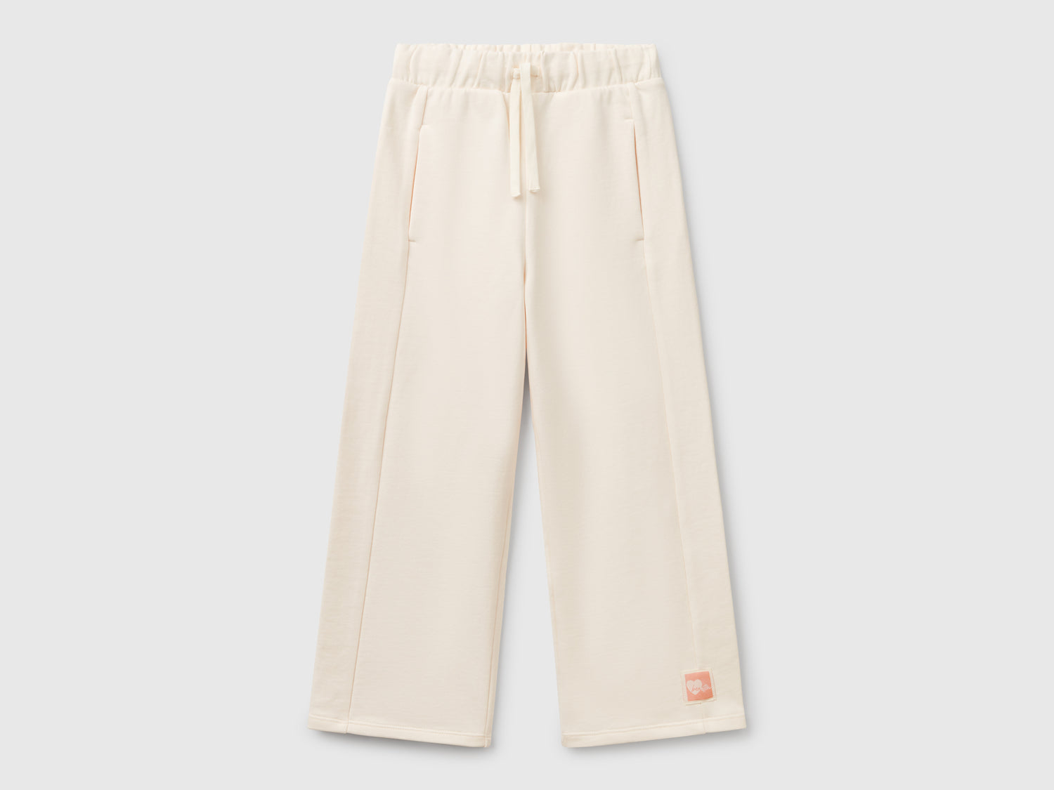 Pantaloni in felpa wide fit da bambina bianco panna | Benetton Outlet