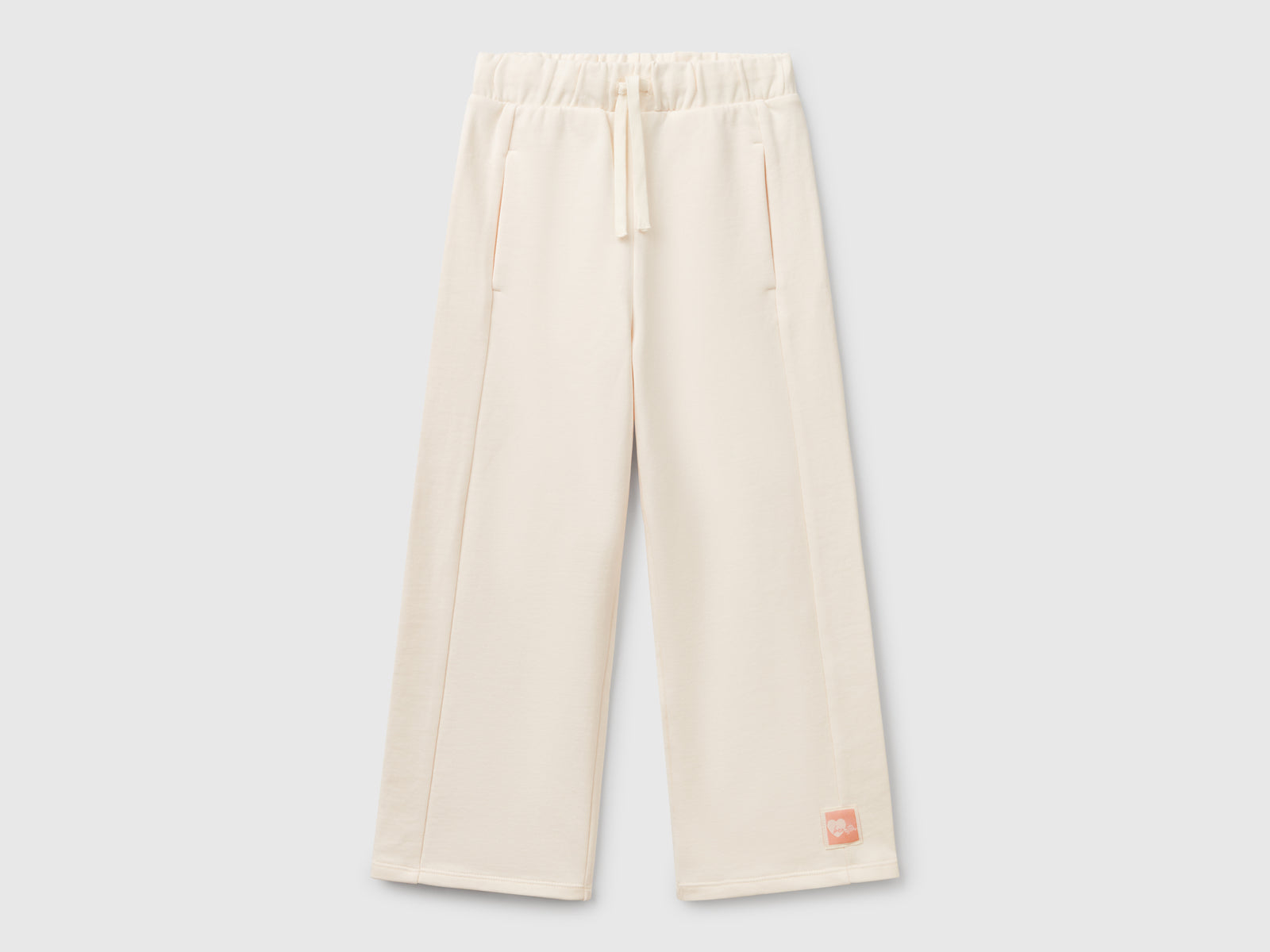 Pantaloni in felpa wide fit da bambina bianco panna | Benetton Outlet