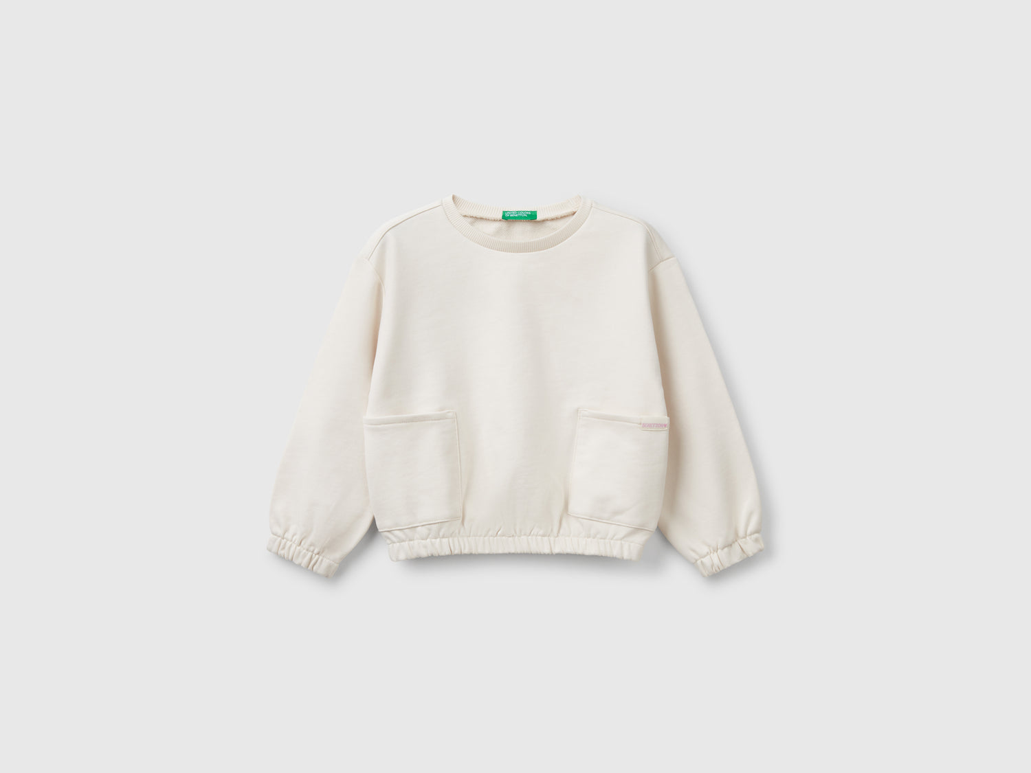 Felpa con tasche da bimba beige | Benetton Outlet