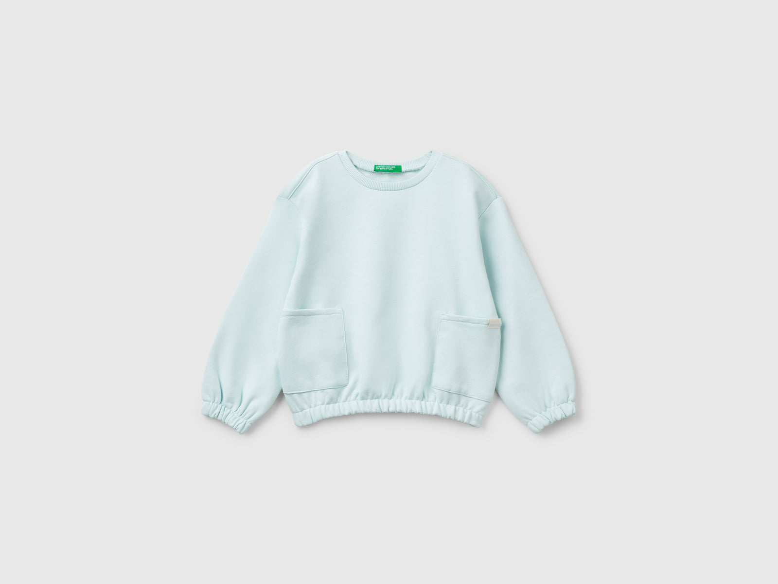 Felpa con tasche da bimba verde acqua | Benetton Outlet