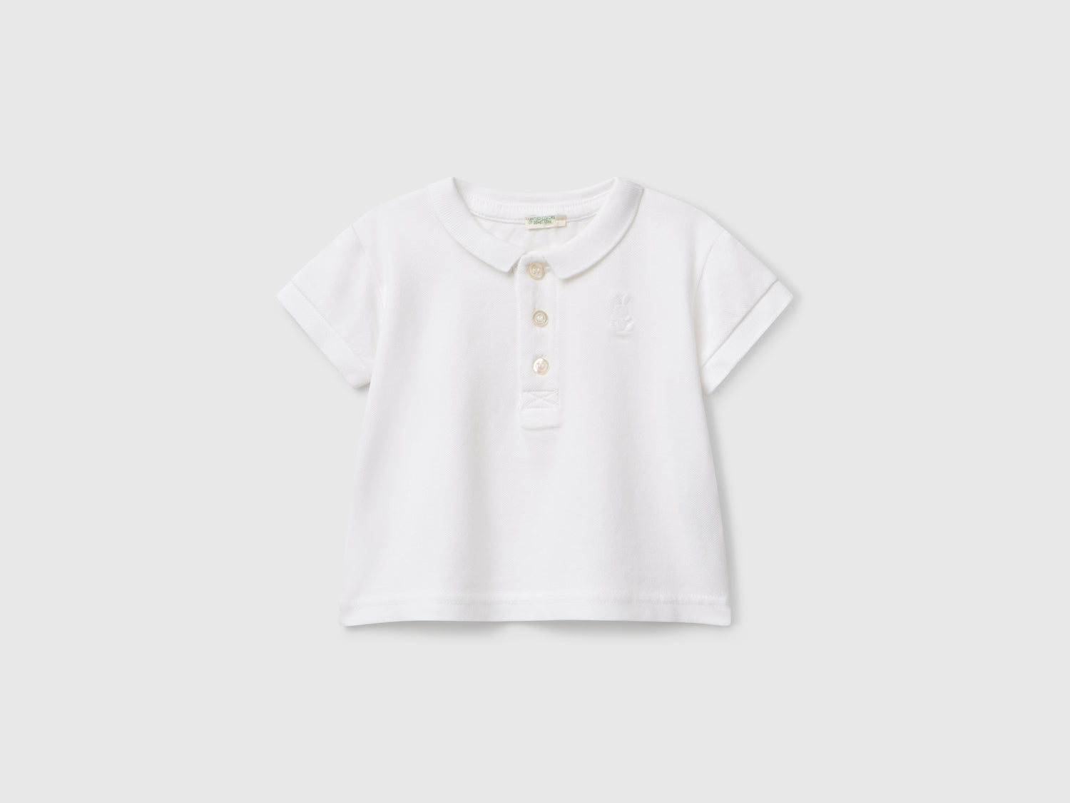 Polo a manica corta da neonato bianco | Benetton Outlet