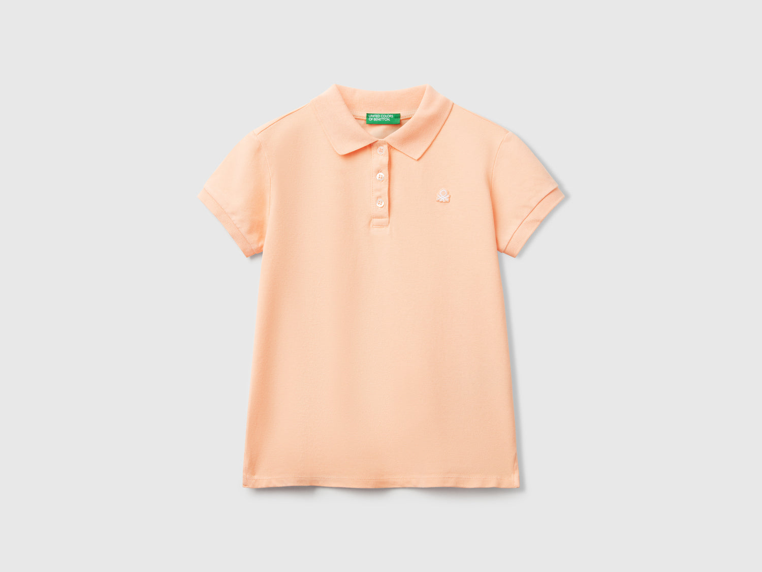 Polo manica corta in cotone da bambina pesca | Benetton Outlet