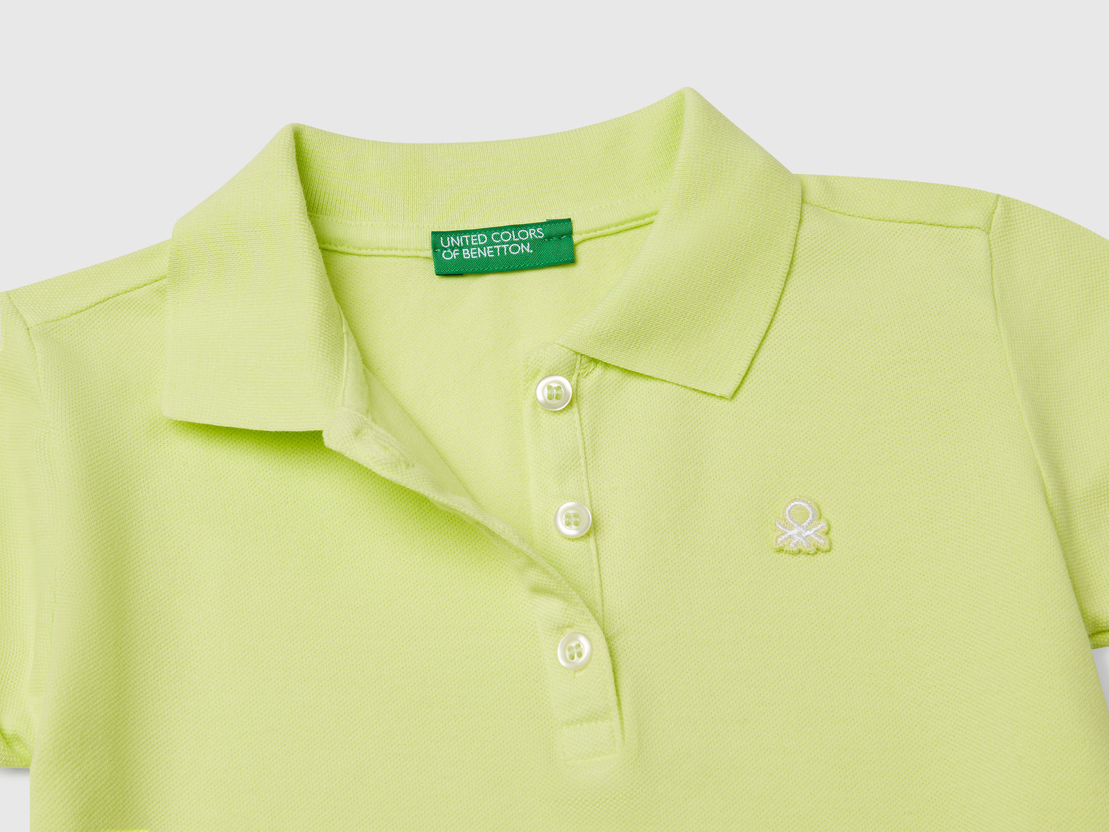 Polo manica corta in cotone da bimba lime 3 | Benetton Outlet