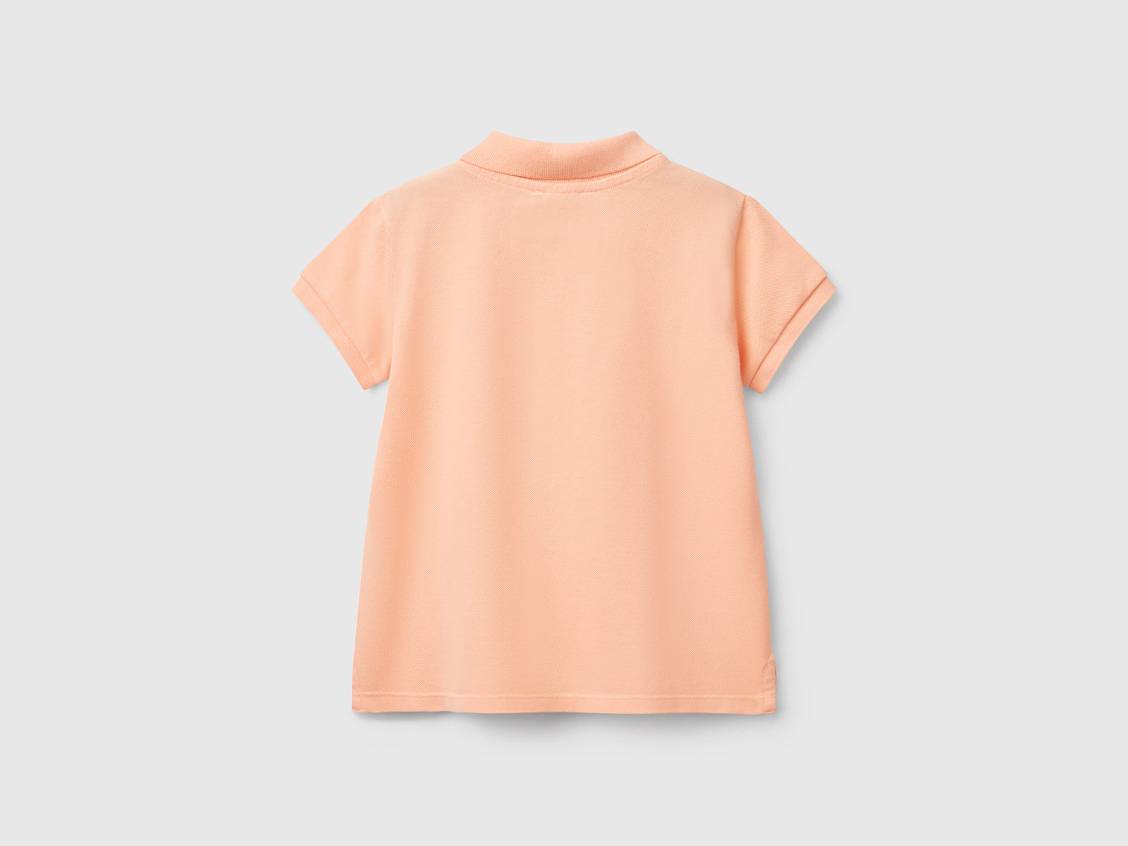 Polo manica corta in cotone da bimba pesca 2 | Benetton Outlet