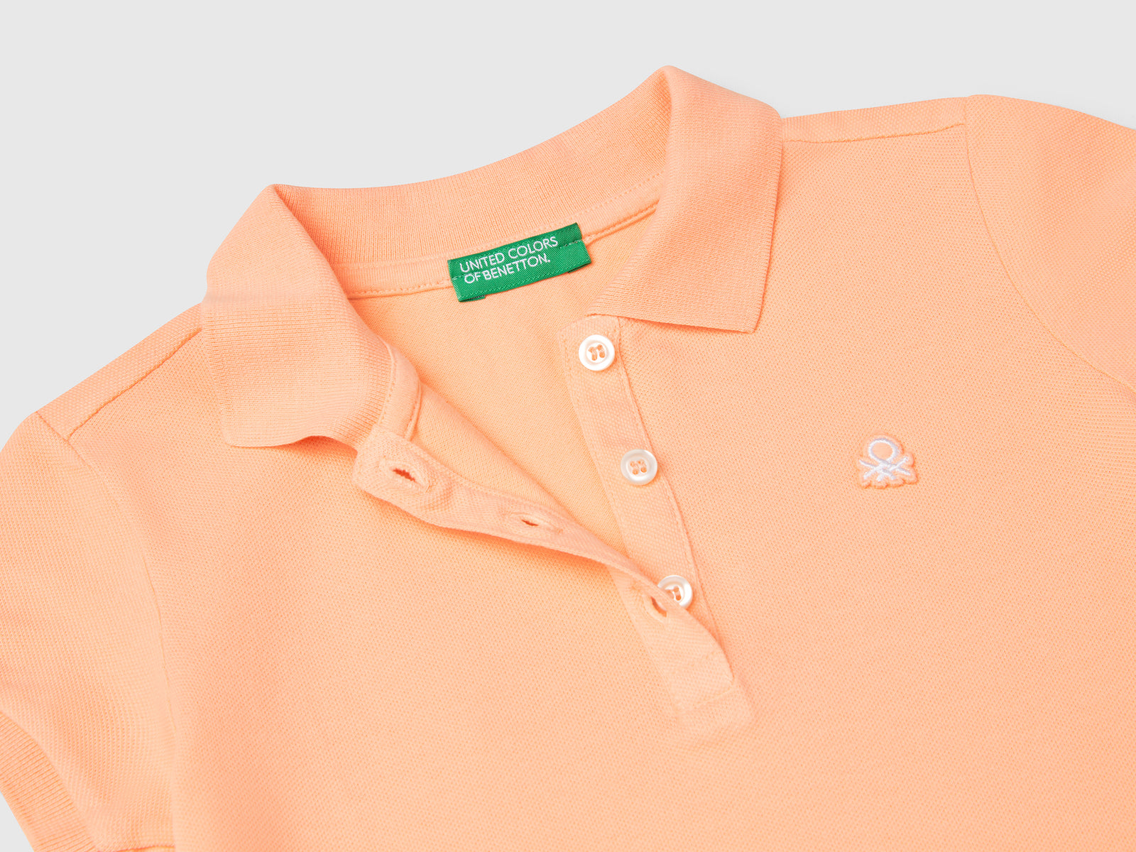 Polo manica corta in cotone da bimba pesca 3 | Benetton Outlet