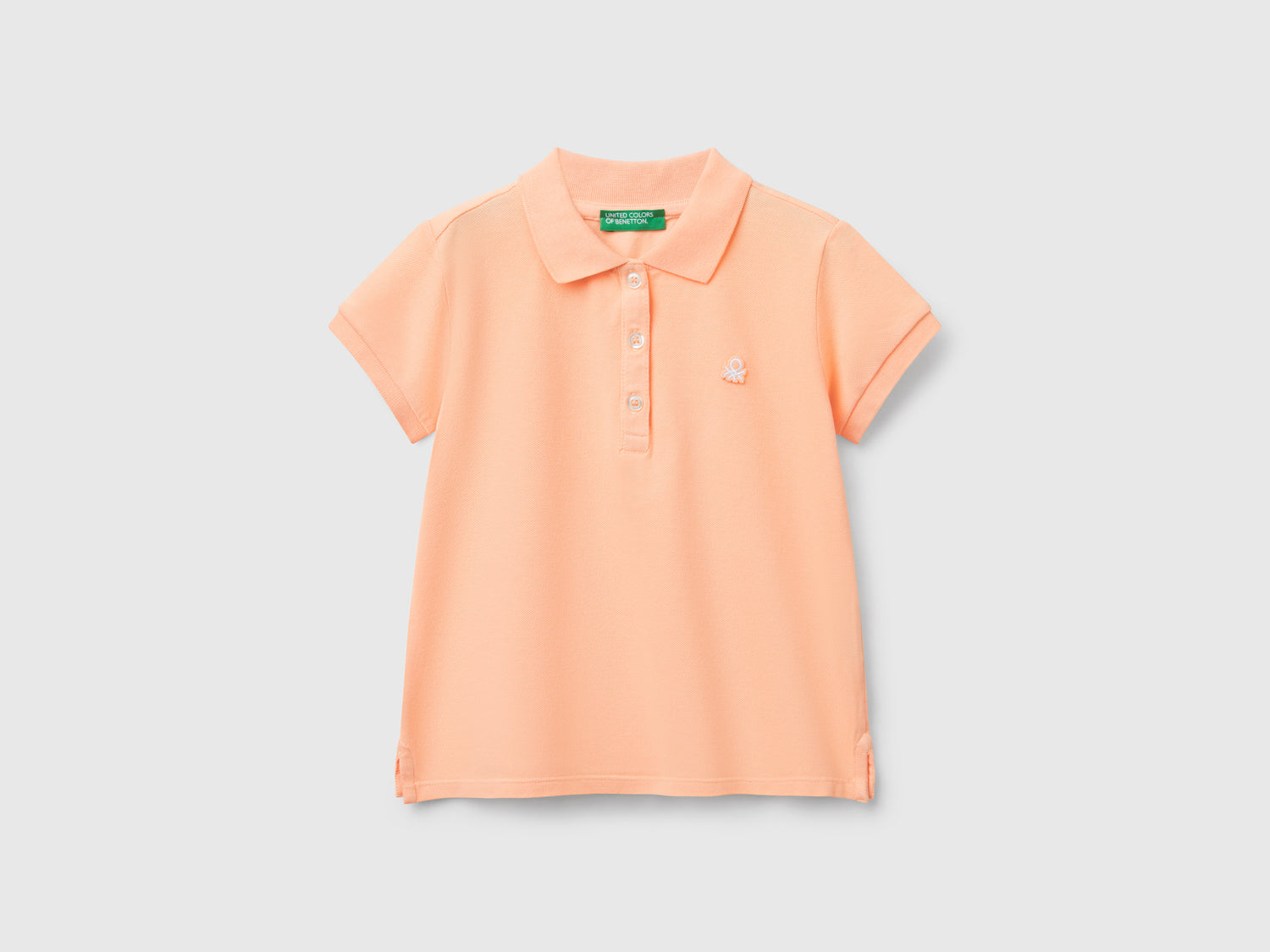 Polo manica corta in cotone da bimba pesca | Benetton Outlet