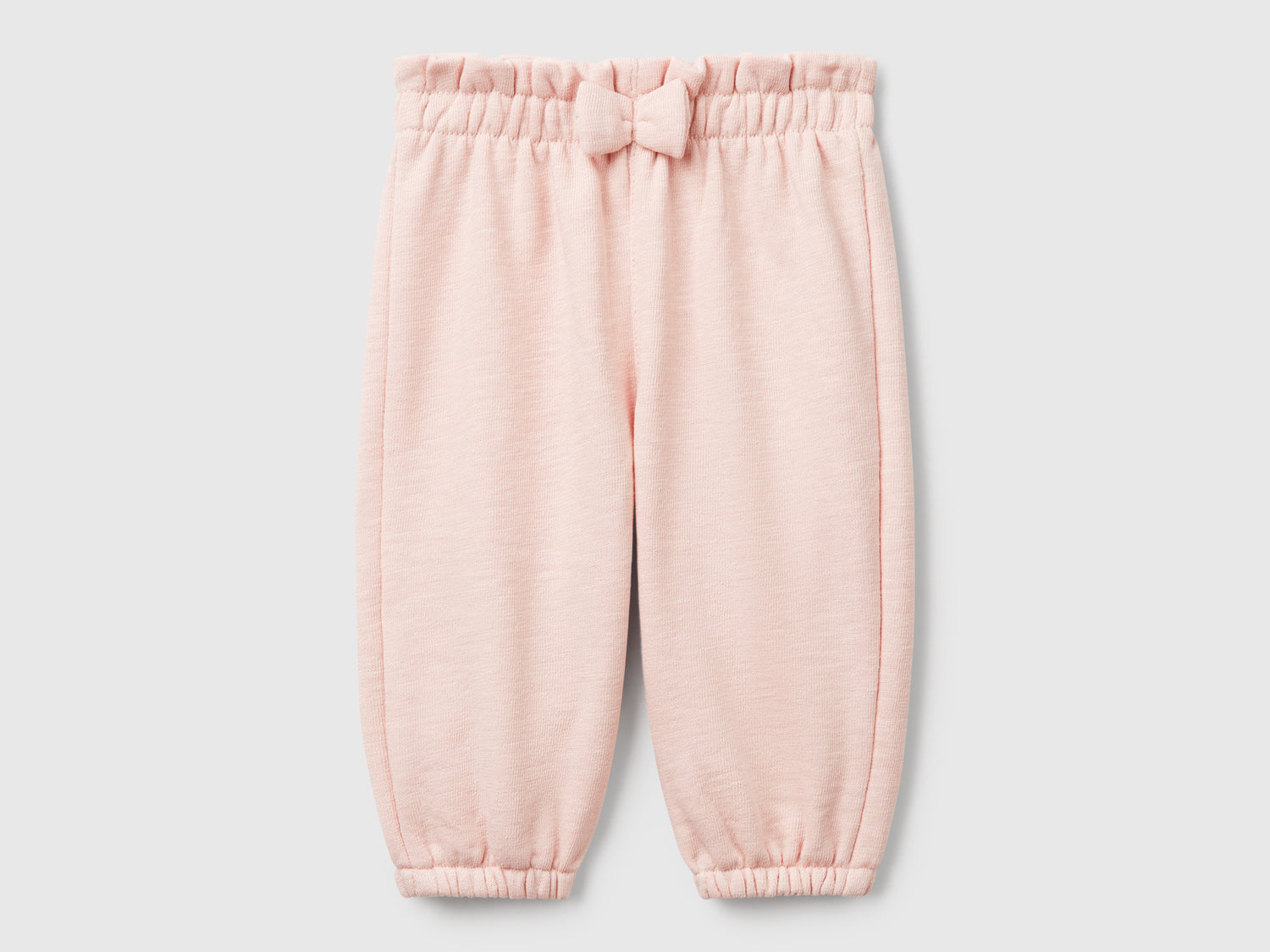 Pantaloni in spugna da neonato rosa tenue | Benetton Outlet