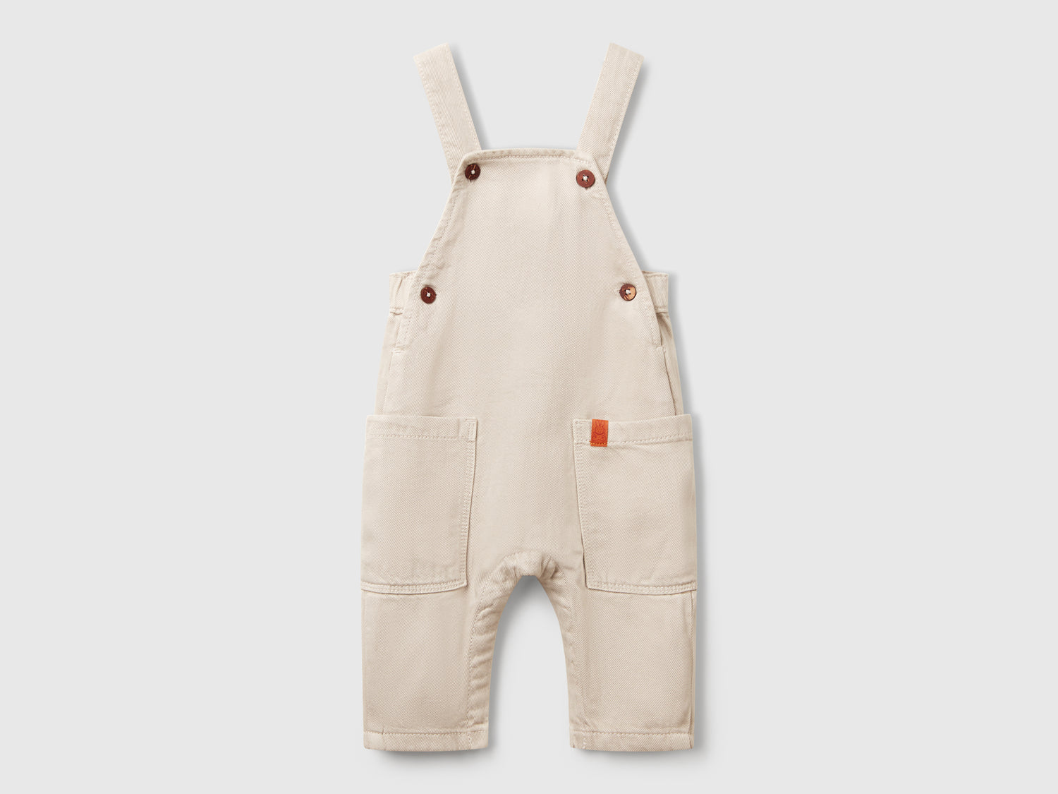 Salopette fluida con tasche da neonato beige | Benetton Outlet