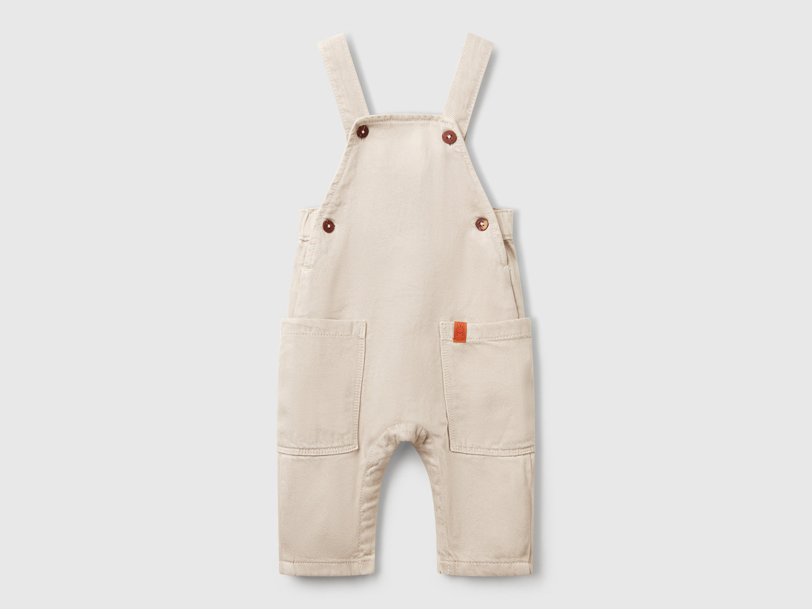 Salopette fluida con tasche da neonato beige | Benetton Outlet