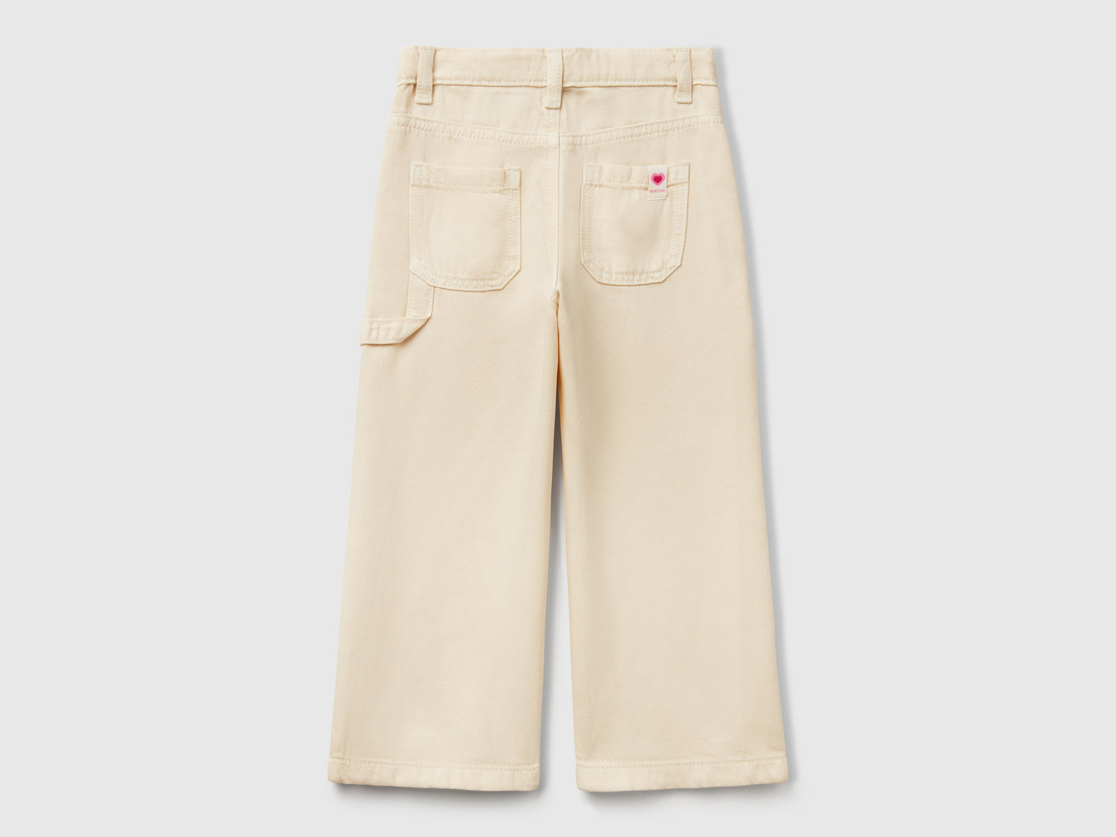 Pantaloni fluidi con gamba dritta da bimba bianco panna 2 | Benetton Outlet