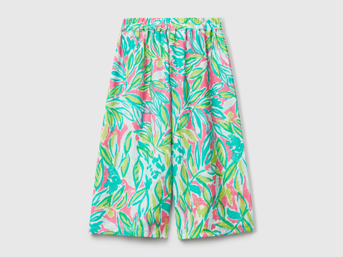 Pantaloni palazzo con stampa tropicale