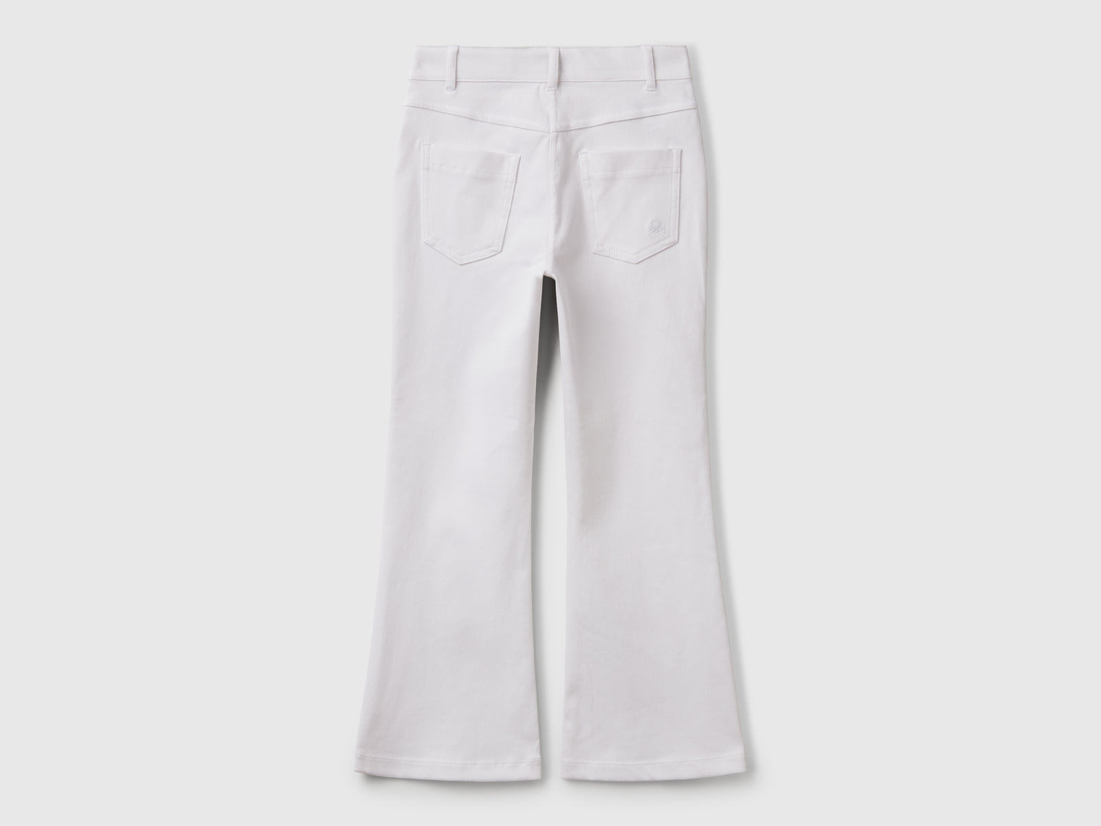 Pantaloni a zampa in cotone stretch da bambina bianco 2 | Benetton Outlet
