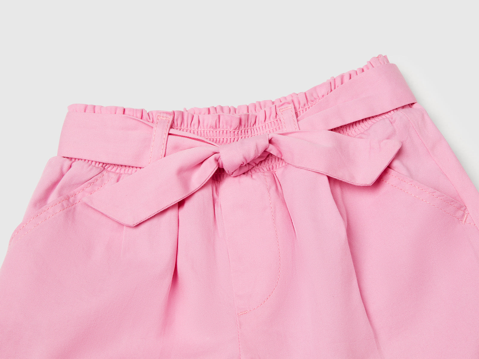 Pantaloni corti con fusciacca da bimba rosa 3 | Benetton Outlet