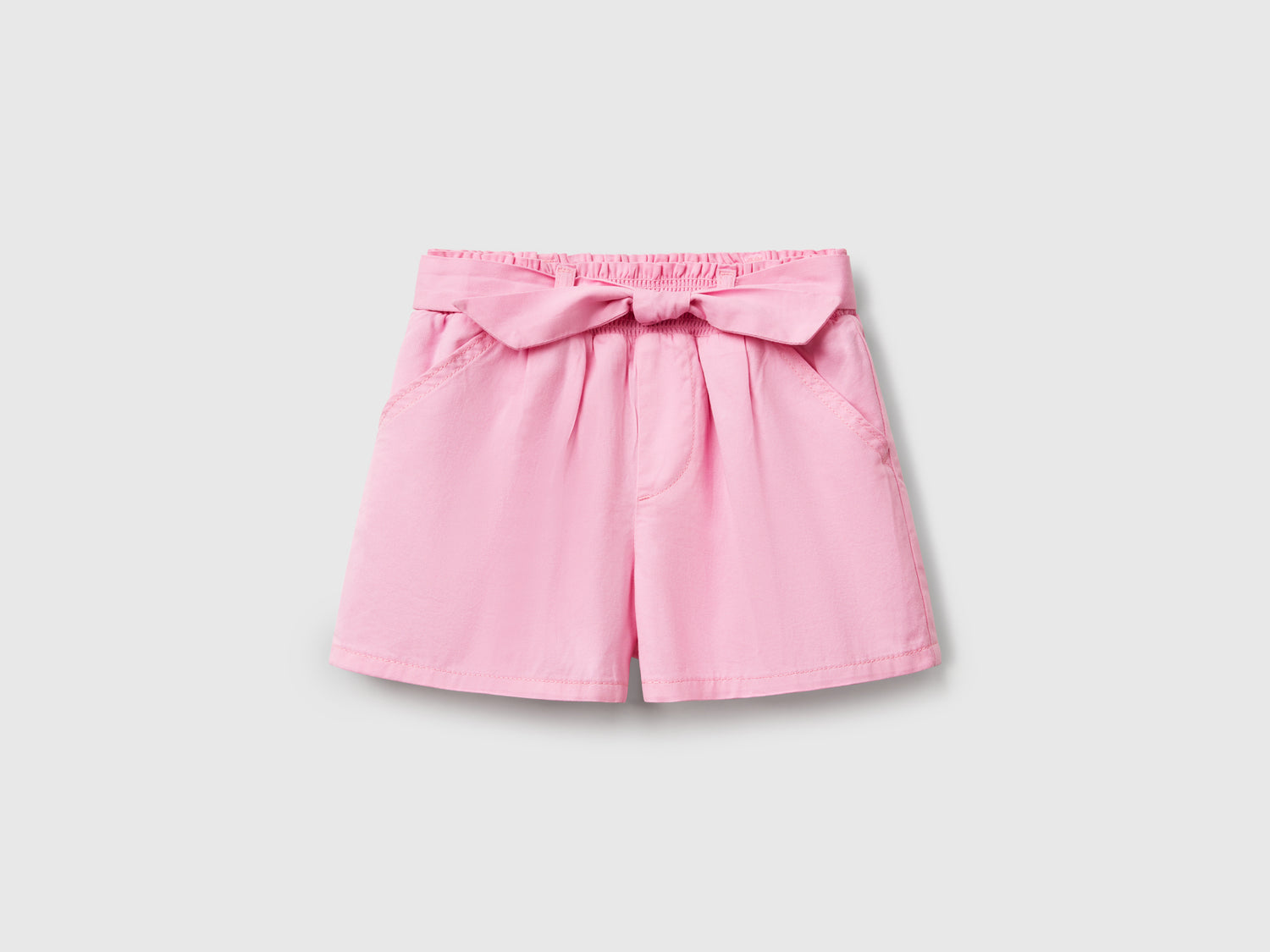 Pantaloni corti con fusciacca da bimba rosa | Benetton Outlet