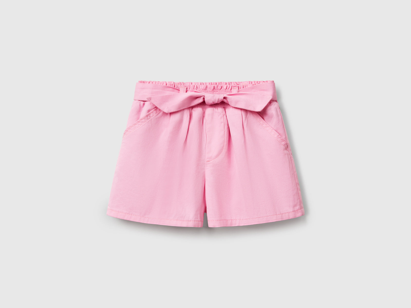 Pantaloni corti con fusciacca da bimba rosa | Benetton Outlet