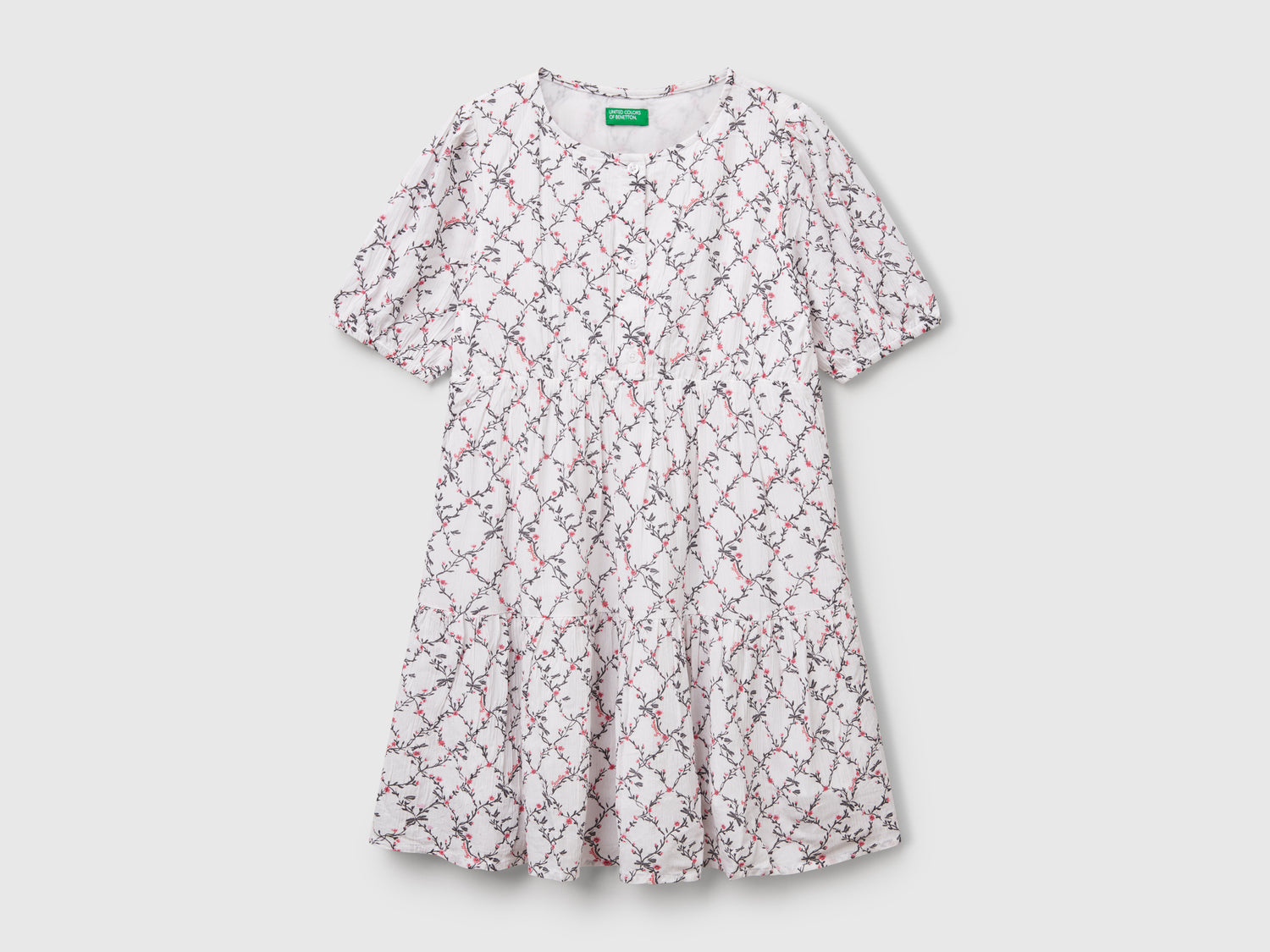 Abito fluido a fiori da bambina bianco | Benetton Outlet