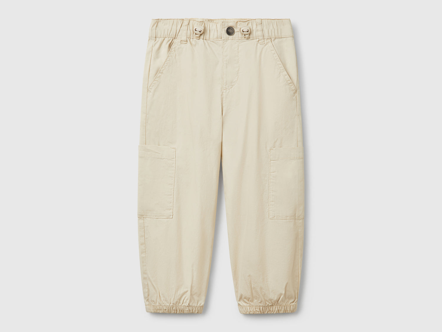 Pantaloni parachute in cotone stretch da bimbo beige | Benetton Outlet