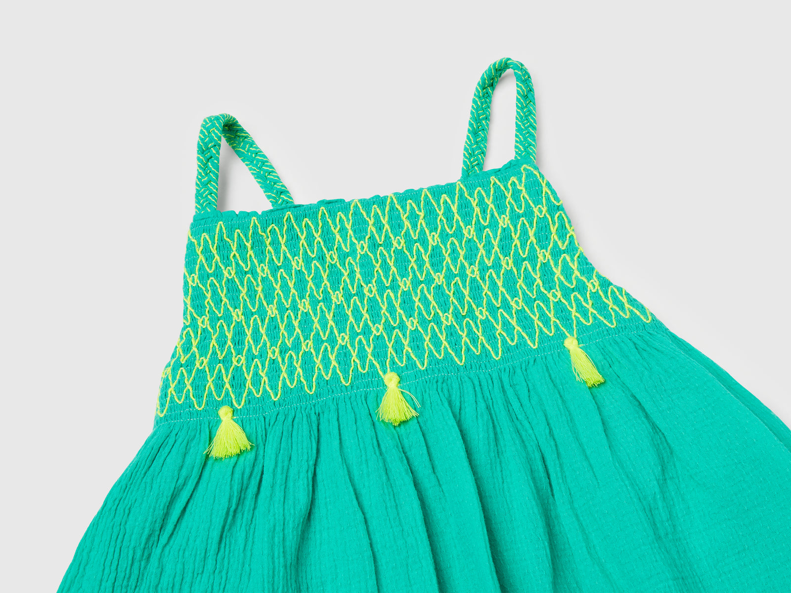 Vestito con nappine fluo da bimba celeste fluo 3 | Benetton Outlet