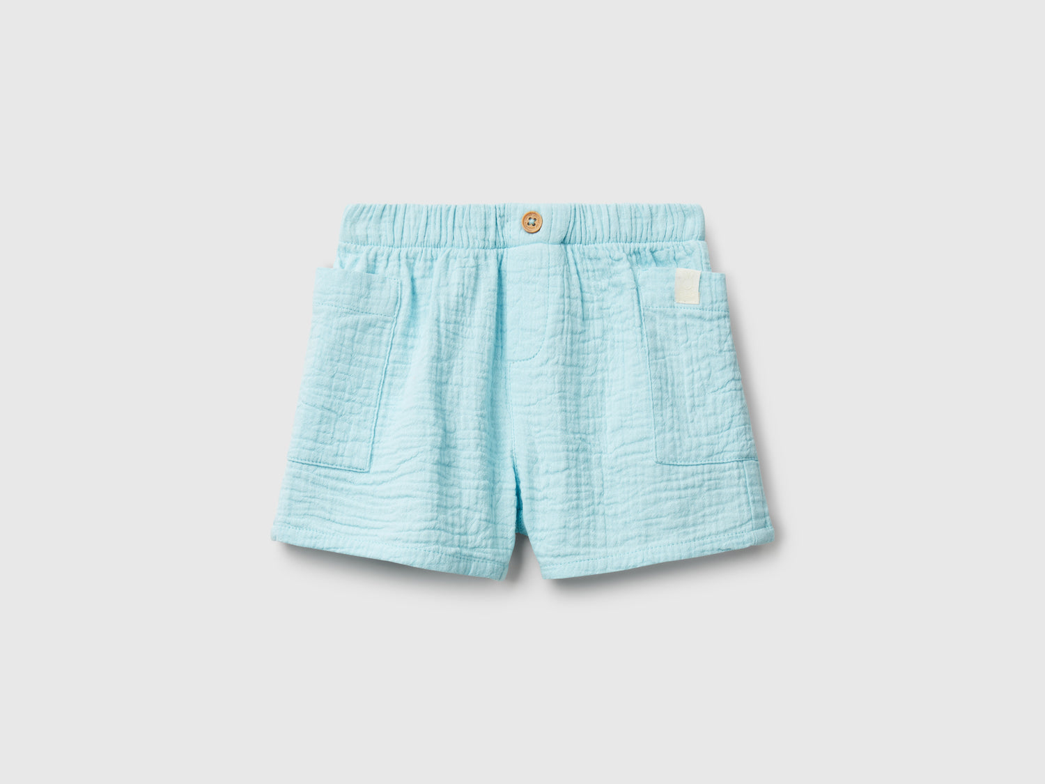 Shorts con tasche da neonato azzurro | Benetton Outlet
