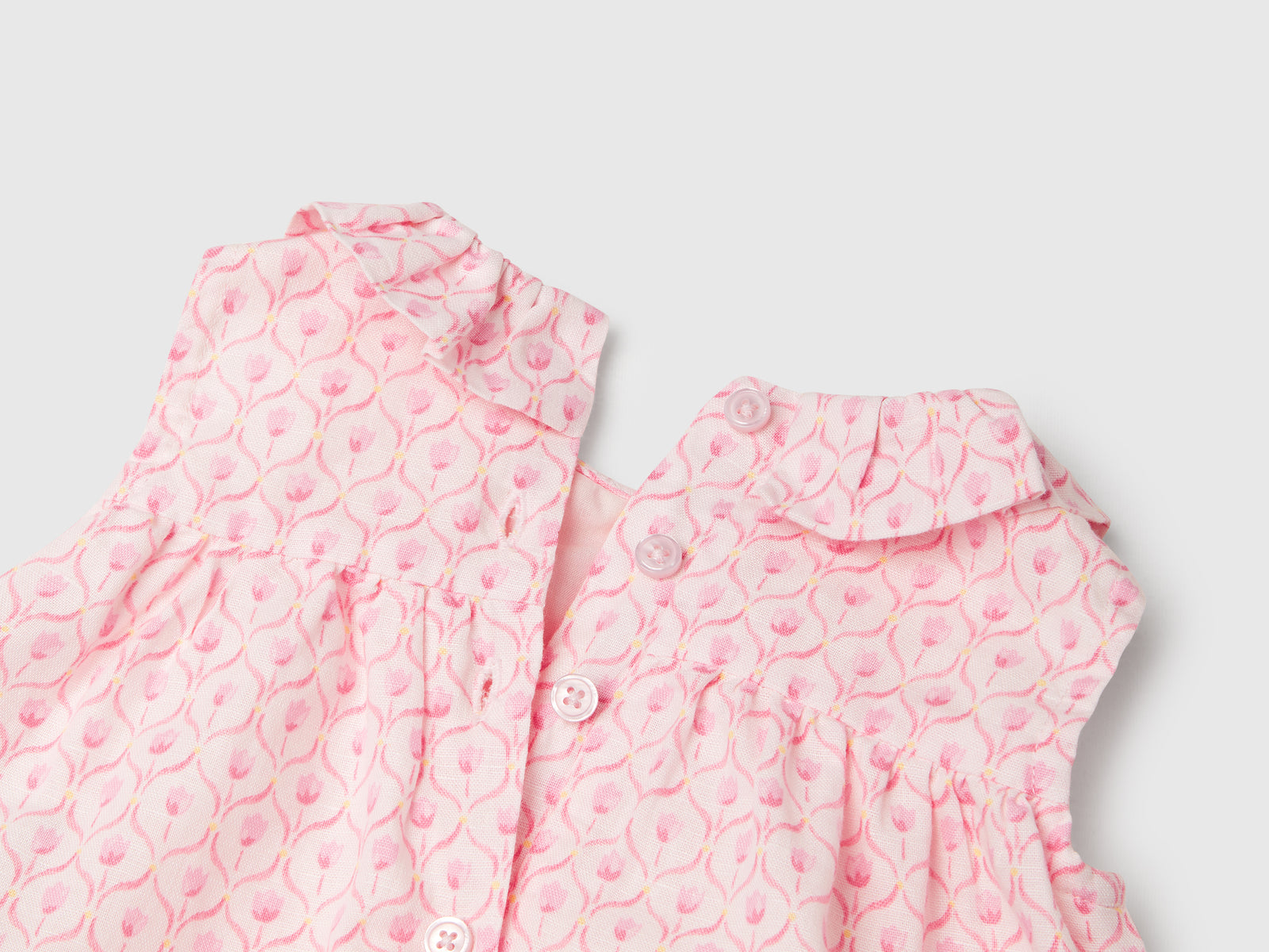 Abito con collo volant da neonato rosa pastello 3 | Benetton Outlet