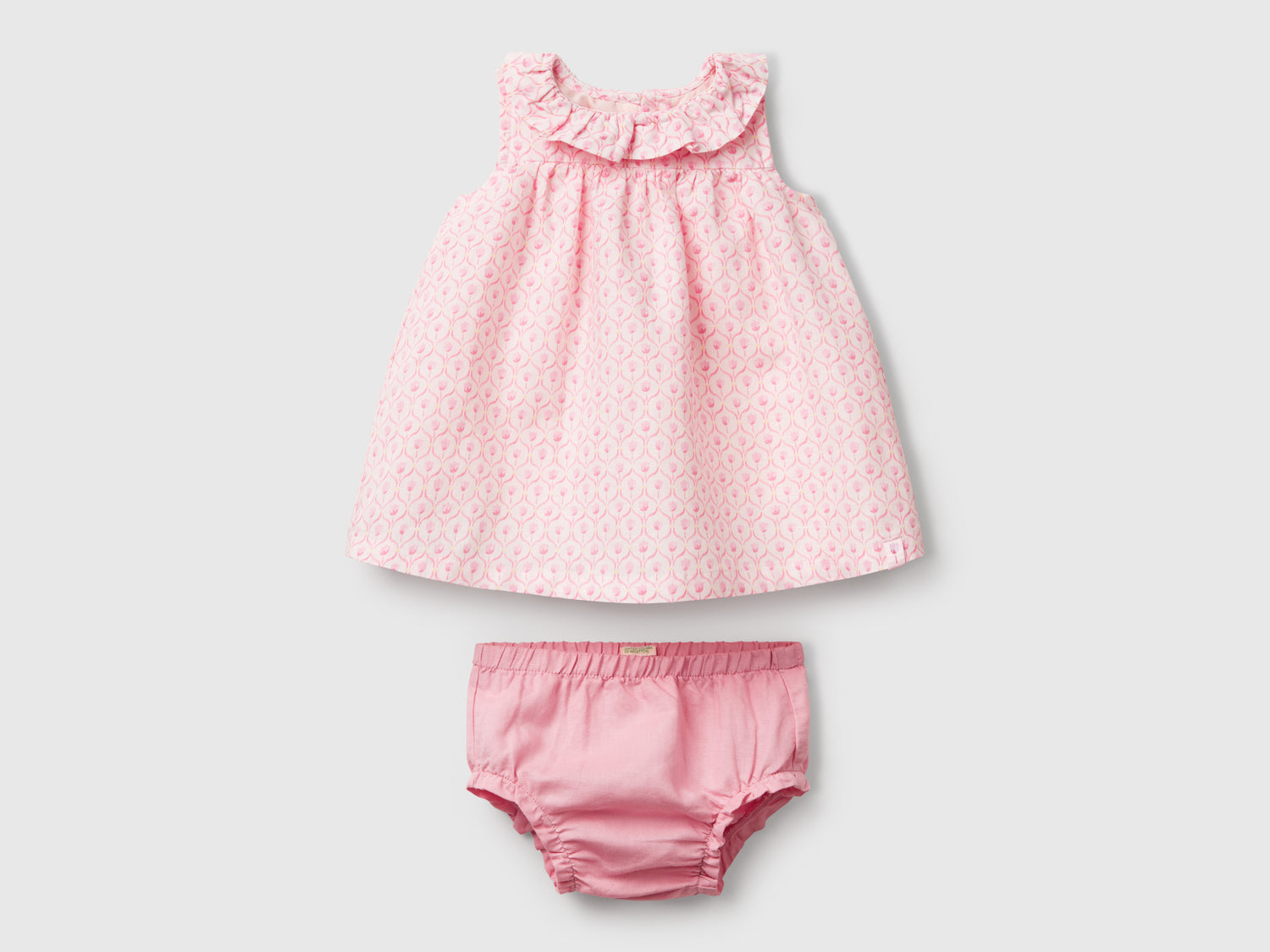 Abito con collo volant da neonato rosa pastello | Benetton Outlet
