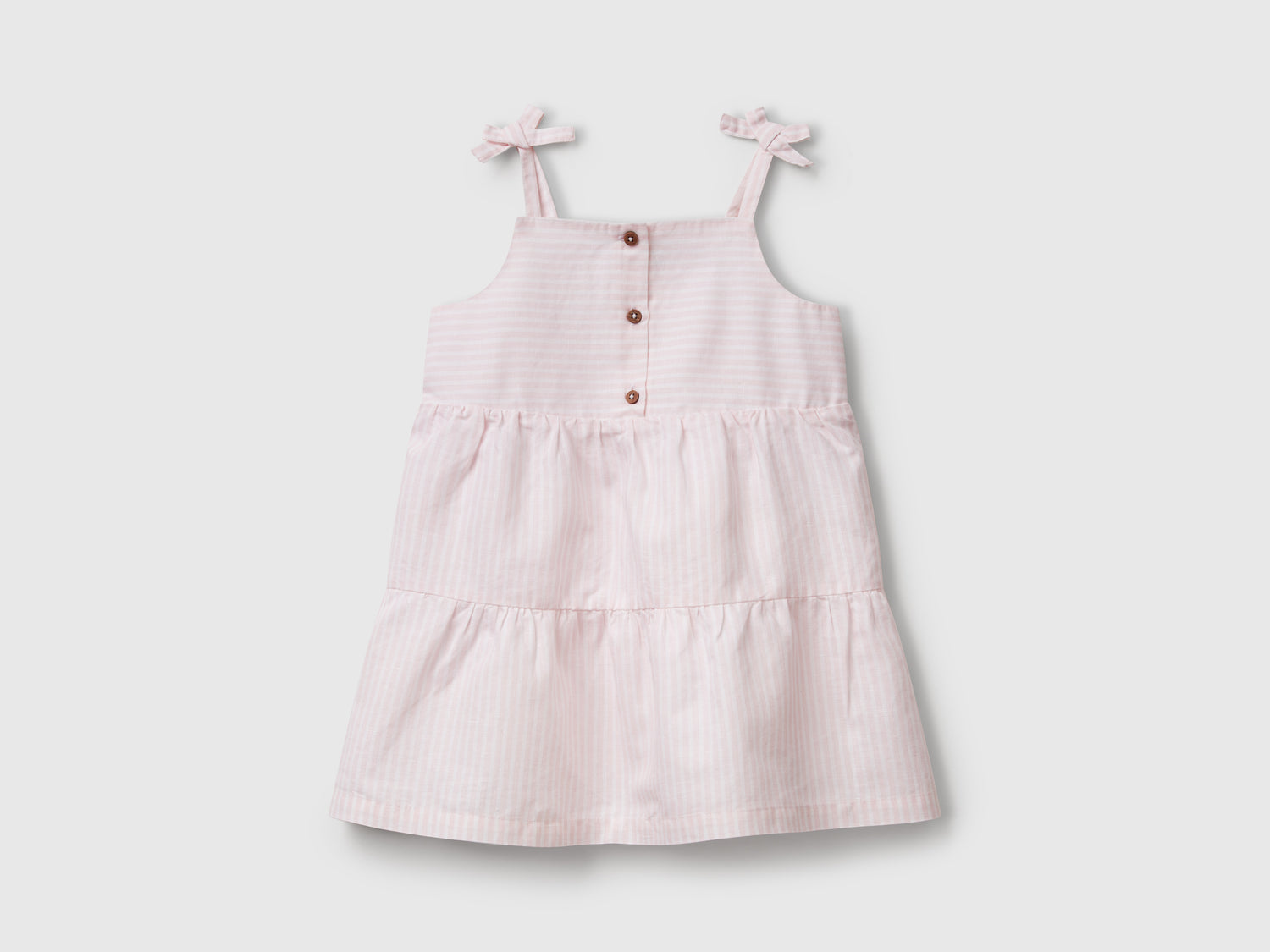 Abito a balze con stampa a righe da bimba rosa | Benetton Outlet