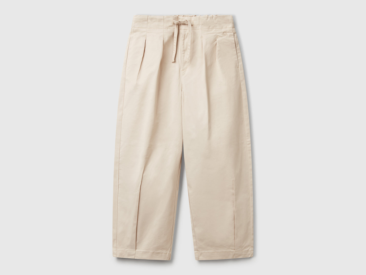 Pantaloni con pinces da bambina beige | Benetton Outlet
