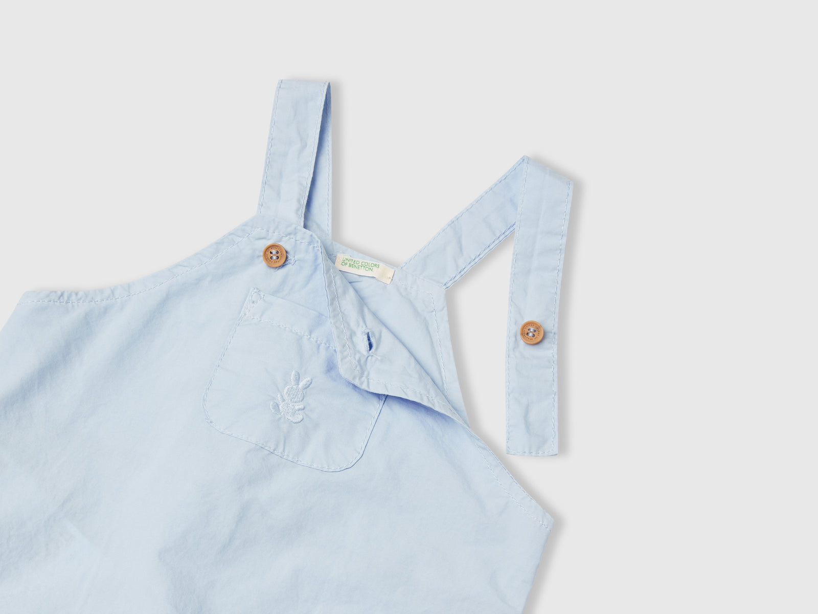 Pagliaccetto salopette in 100% cotone da neonato celeste 3 | Benetton Outlet