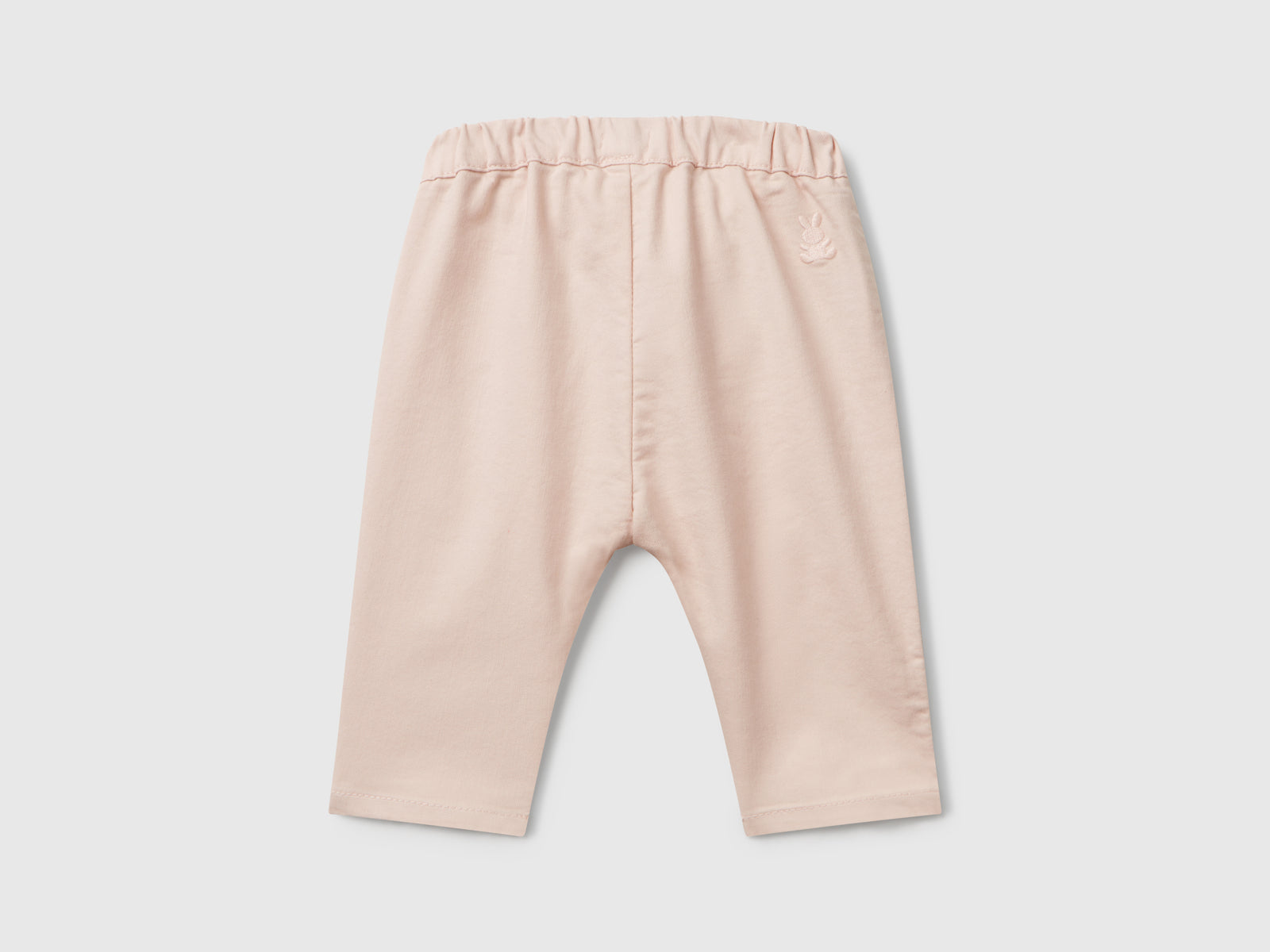 Pantaloni stretch con coulisse da neonato rosa tenue 2 | Benetton Outlet