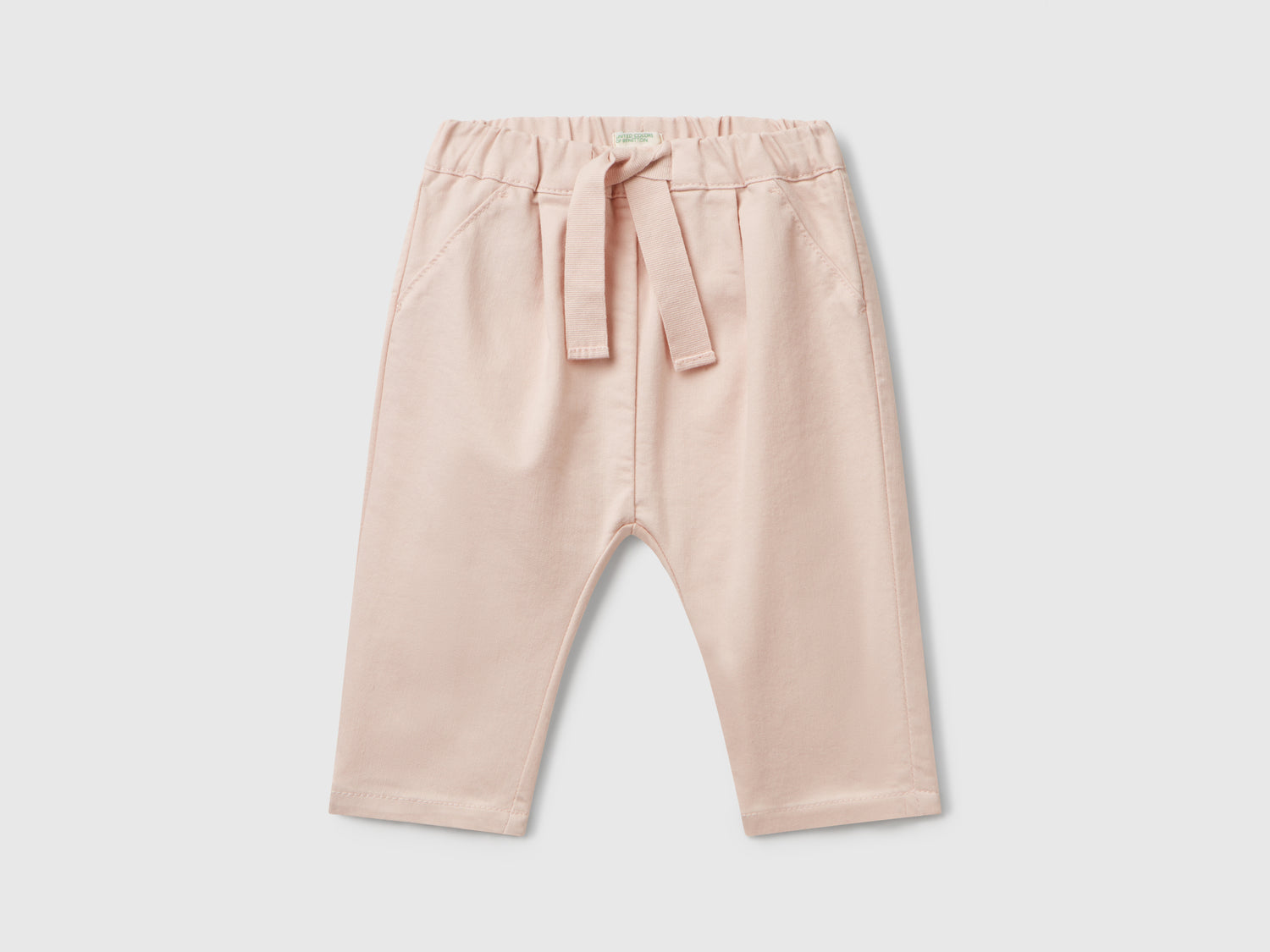 Pantaloni stretch con coulisse da neonato rosa tenue | Benetton Outlet
