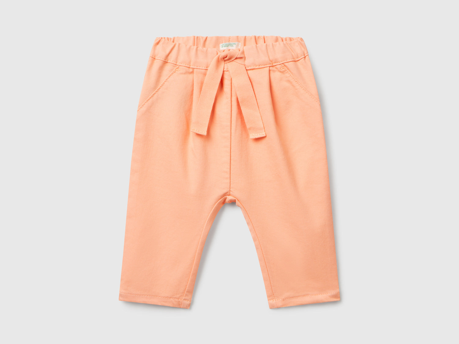 Pantaloni stretch con coulisse da neonato pesca | Benetton Outlet