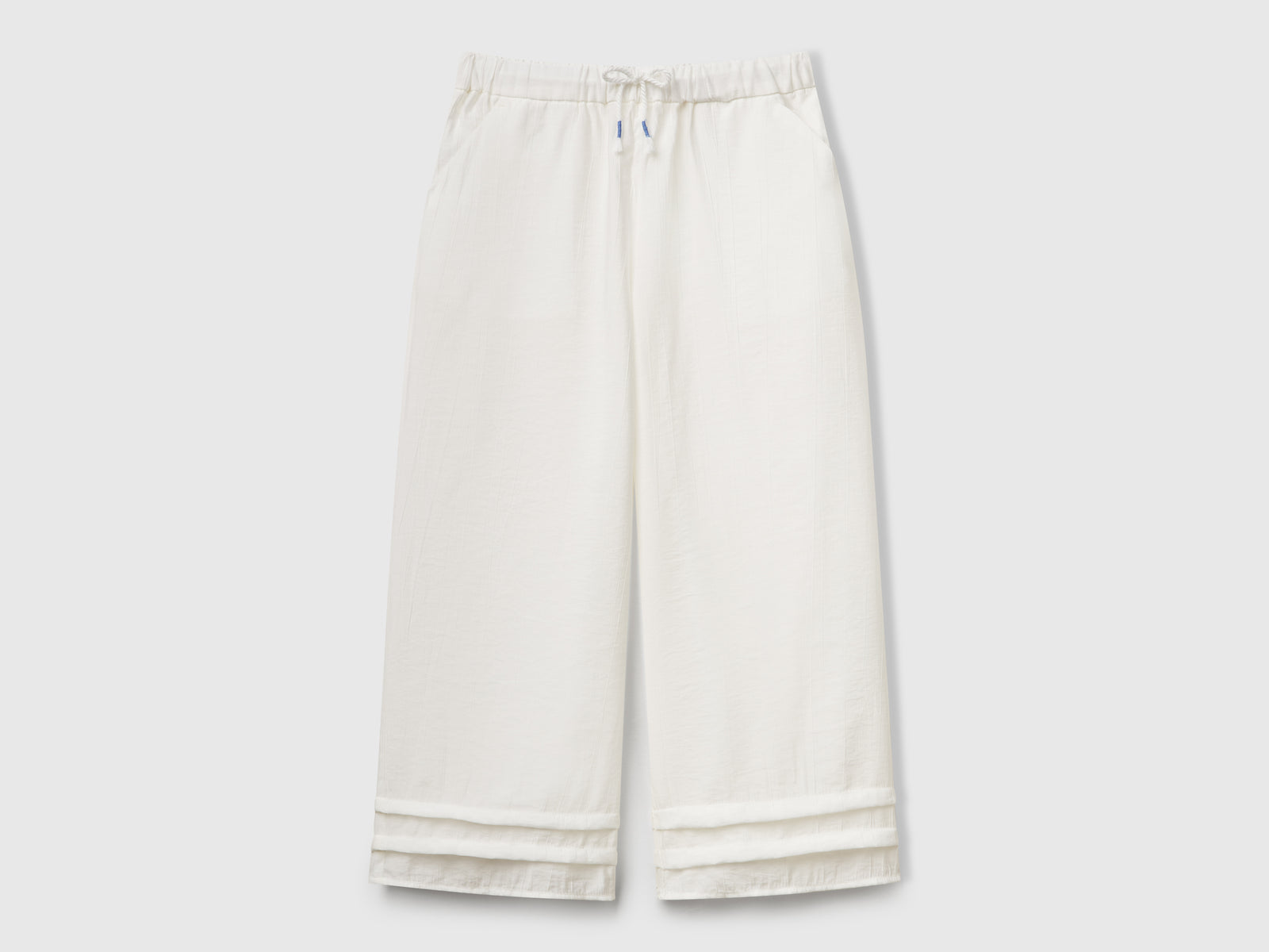 Pantaloni in misto viscosa da bambina bianco panna | Benetton Outlet