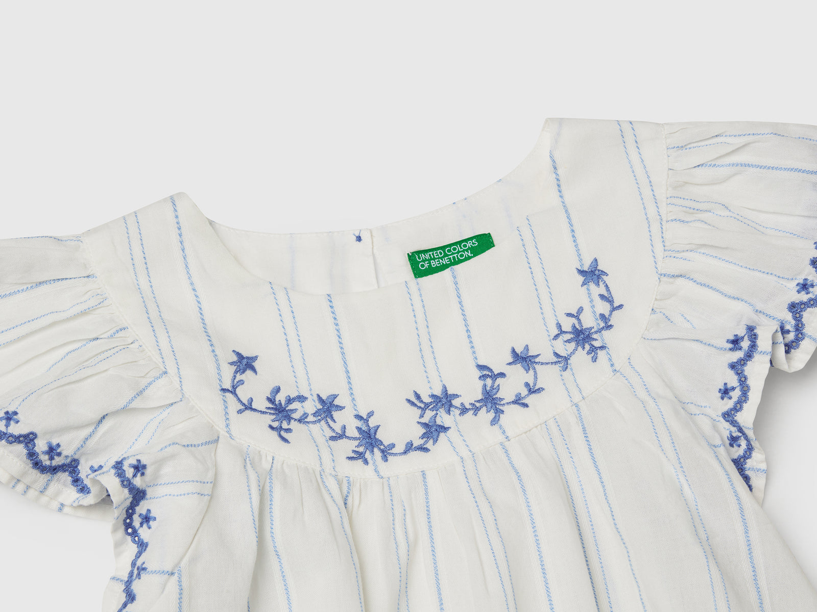 Blusa con ricami floreali da bimba bianco panna 3 | Benetton Outlet