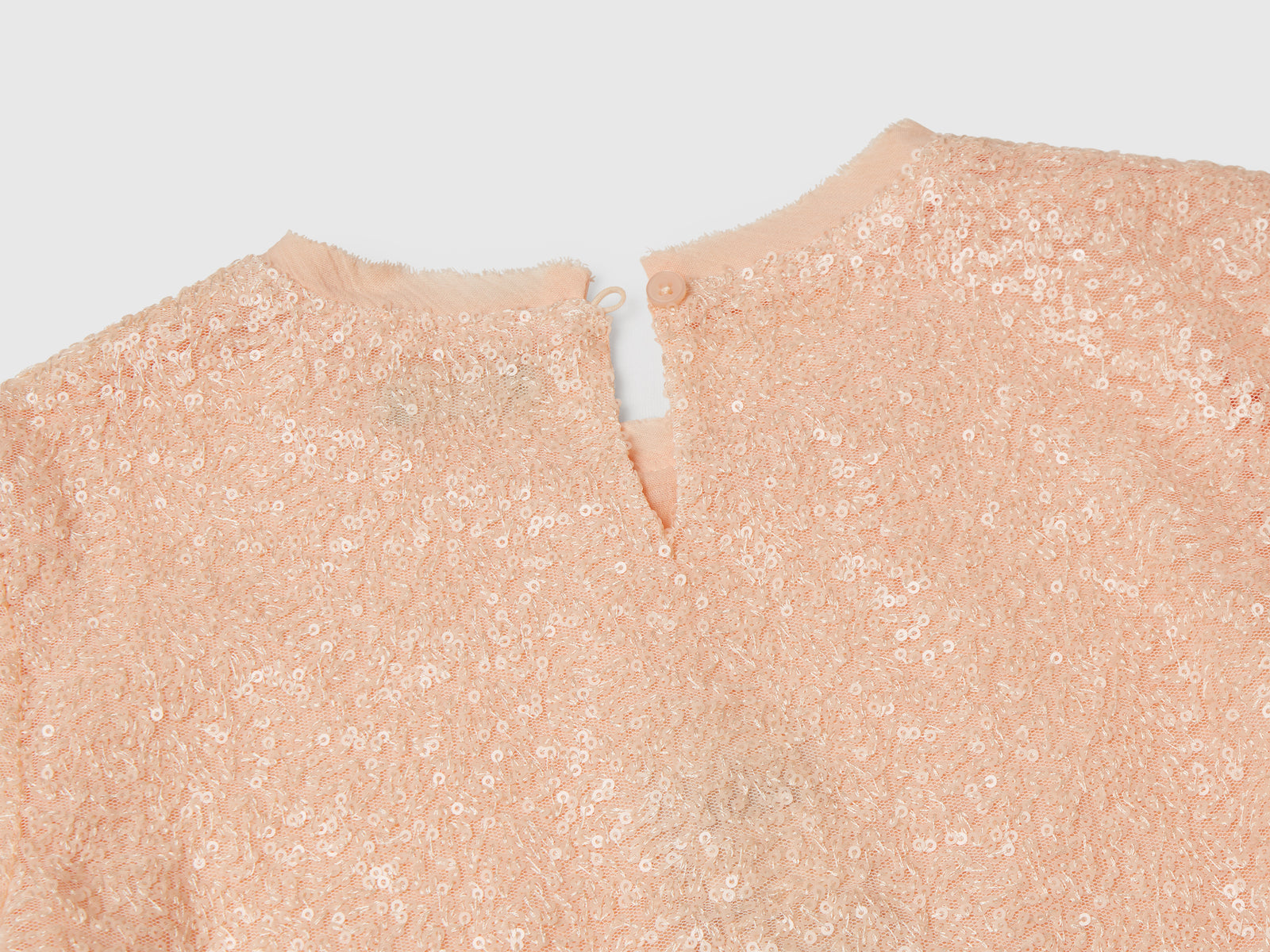 Top con paillettes da bambina rosa tenue 3 | Benetton Outlet