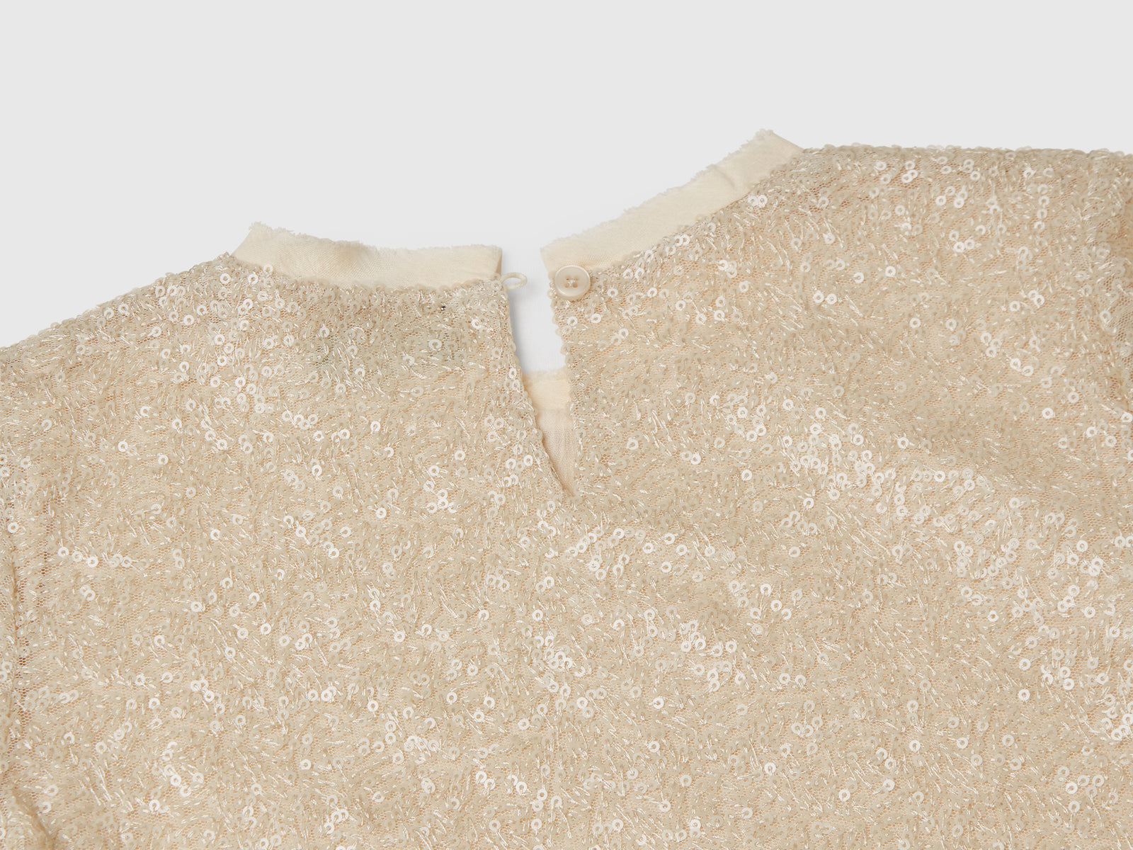 Top con paillettes da bambina bianco panna 2 | Benetton Outlet