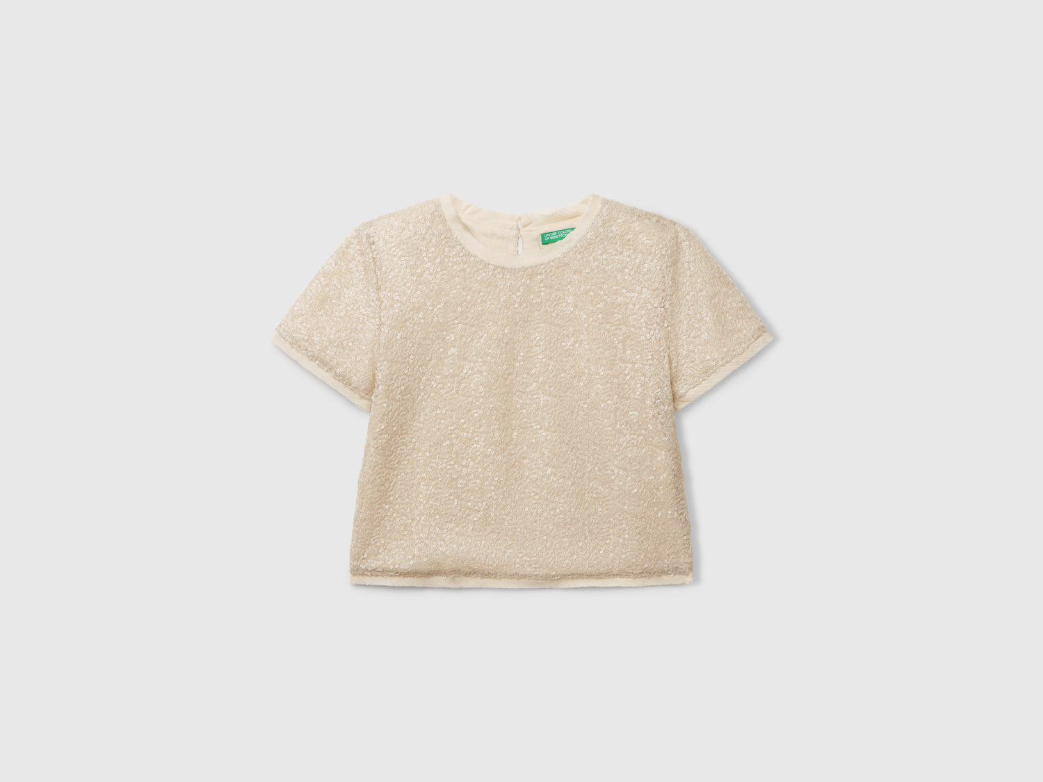 Top con paillettes da bambina bianco panna | Benetton Outlet