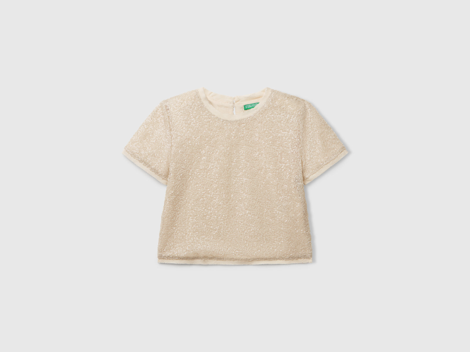 Top con paillettes da bambina bianco panna | Benetton Outlet