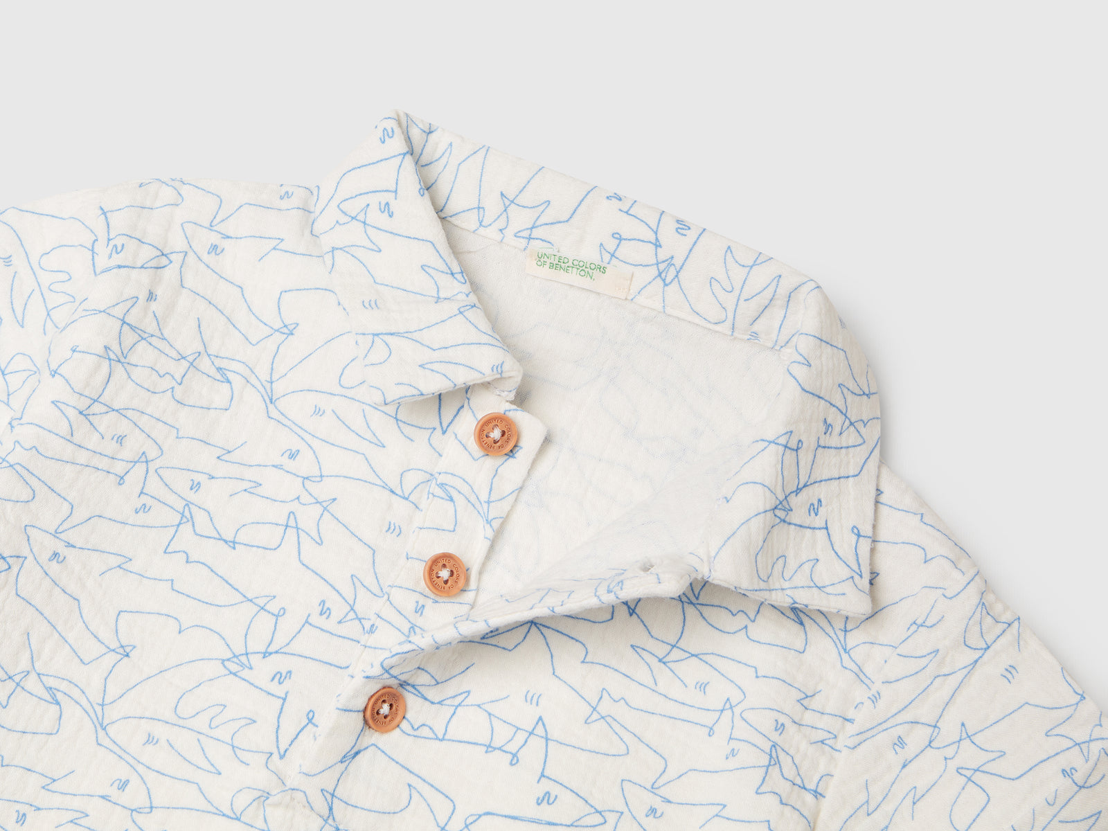 Polo con stampa squali da neonato bianco panna 3 | Benetton Outlet