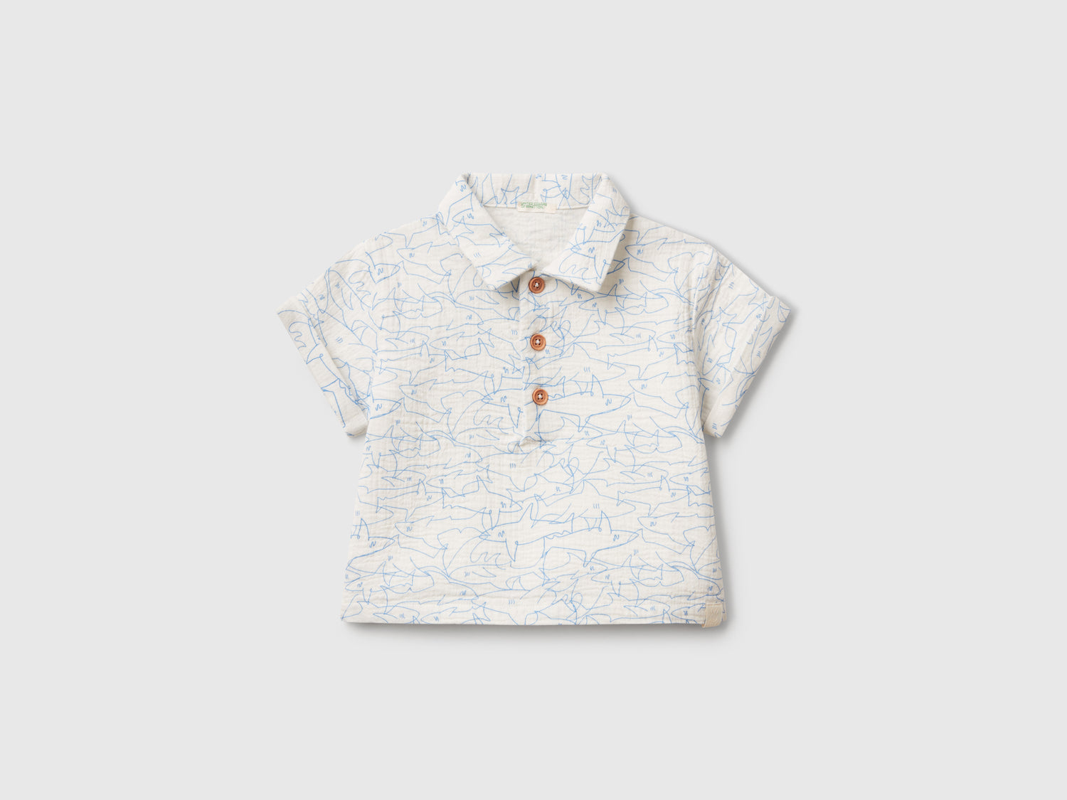Polo con stampa squali da neonato bianco panna | Benetton Outlet