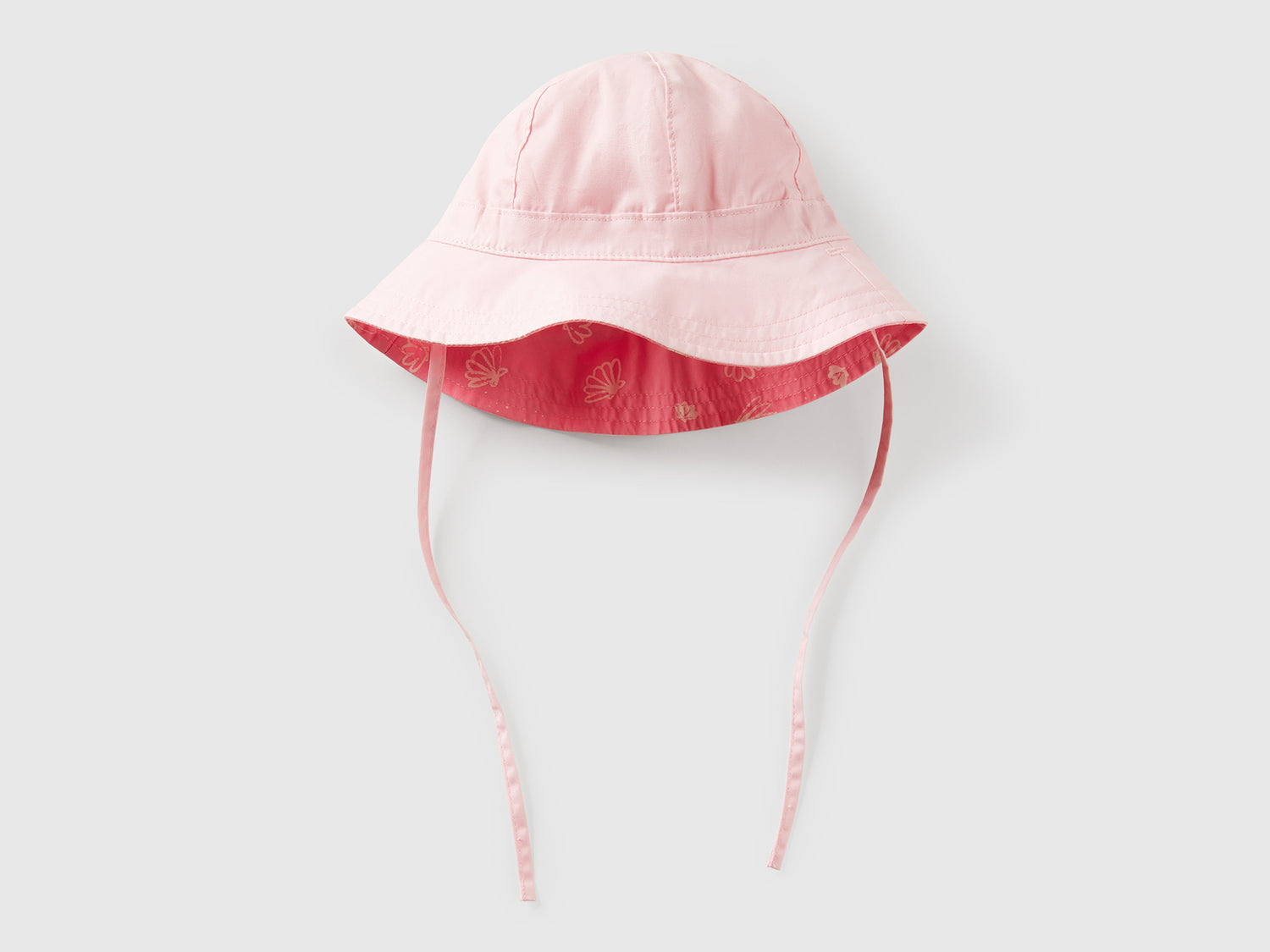 Cappello reversibile con stampa mare da neonato rosa | Benetton Outlet