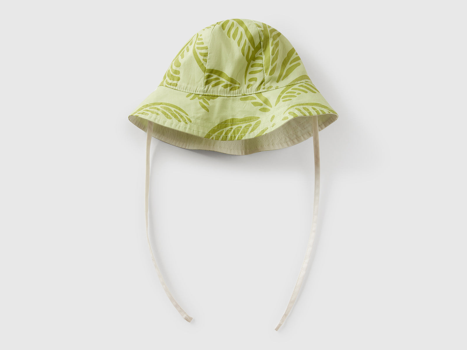 Cappello reversibile con stampa tropicale da neonato verde chiaro 2 | Benetton Outlet