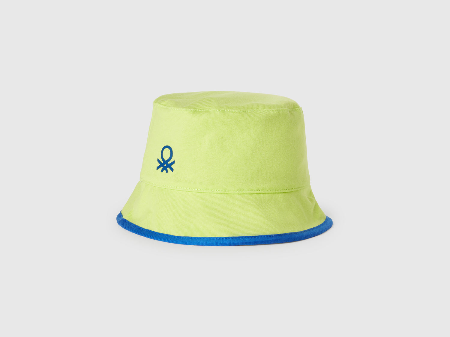 Cappello reversibile con stampa squali da bimbo giallo fluo | Benetton Outlet
