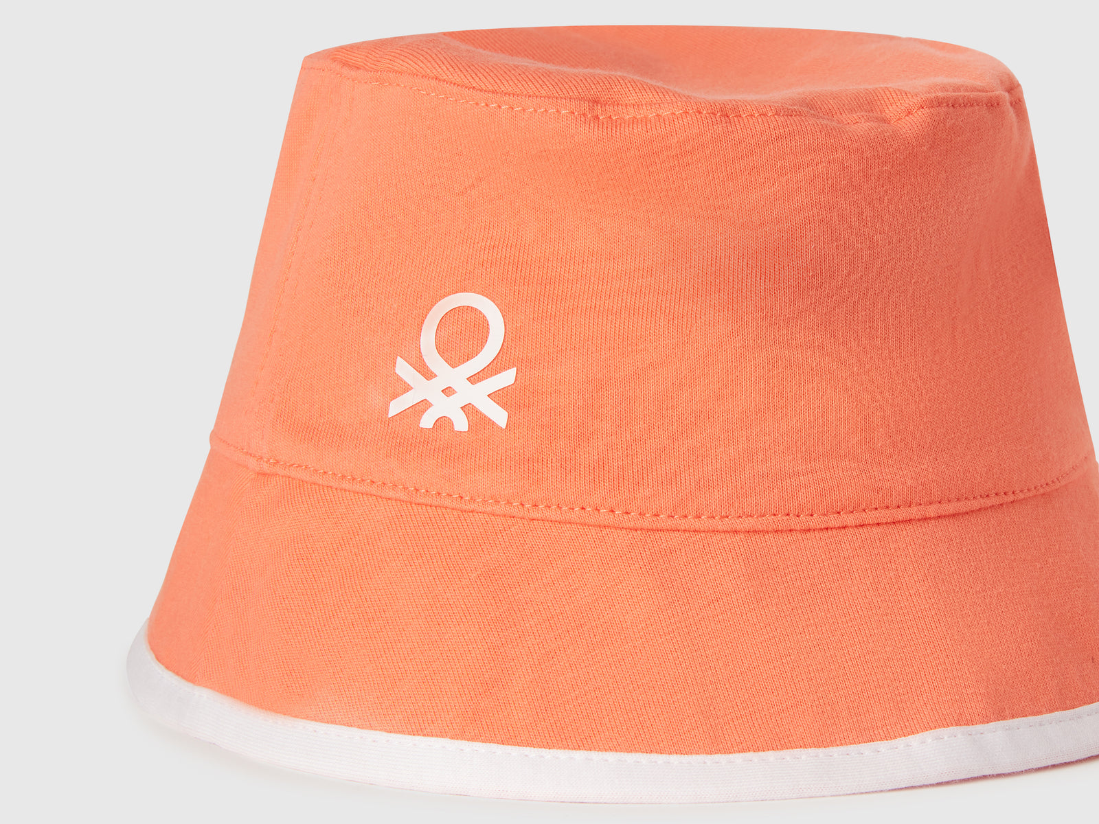 Cappello reversibile con stampa floreale da bimbo arancione 3 | Benetton Outlet