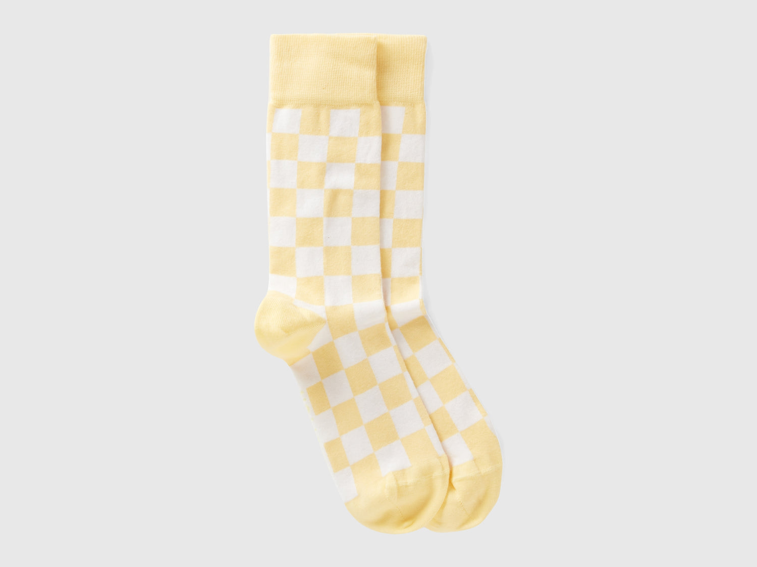 Calcetines largos a cuadros y da uomo giallo | Benetton Outlet