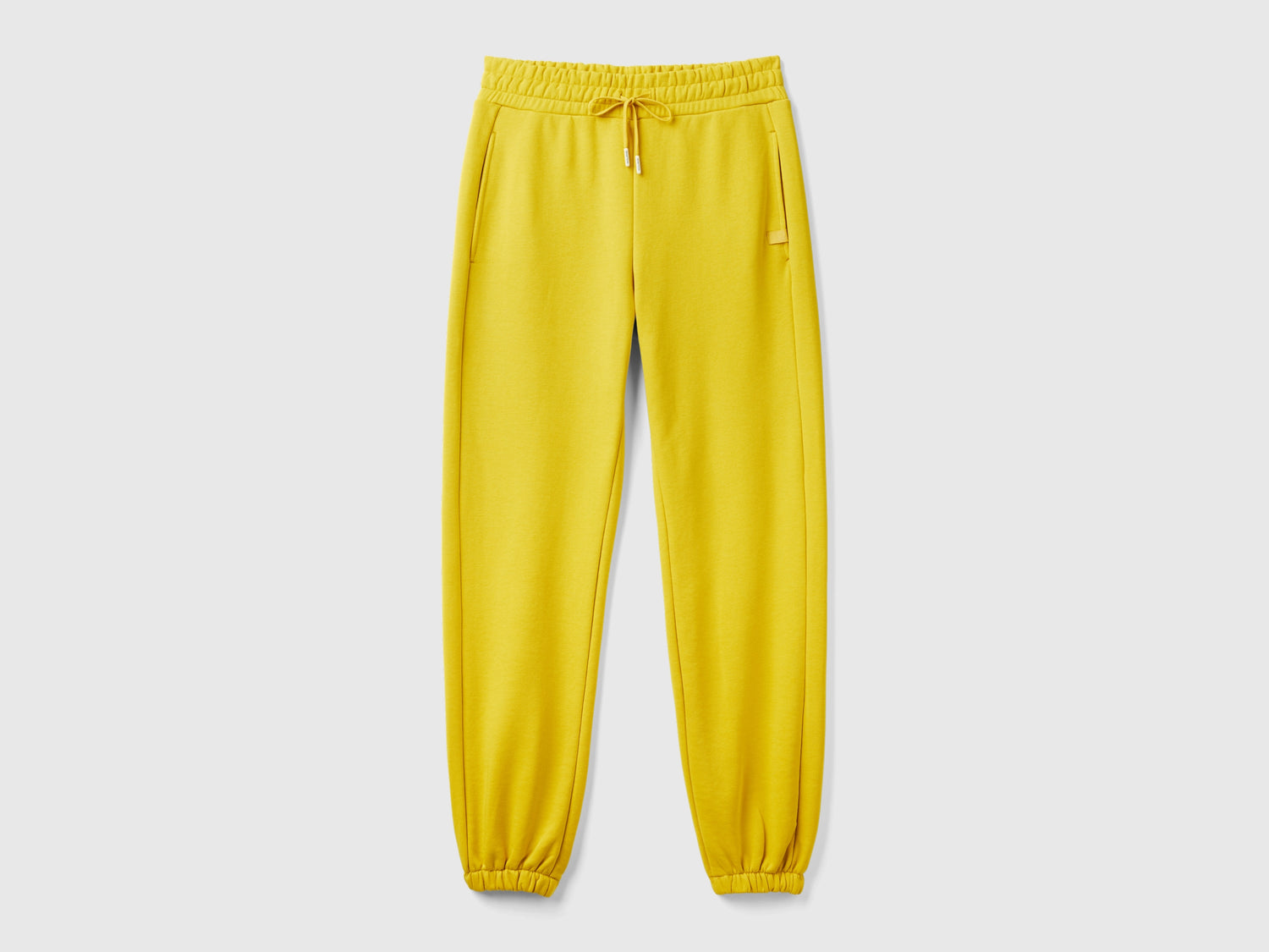 Pantaloni in felpa con coulisse da donna giallo | Benetton Outlet