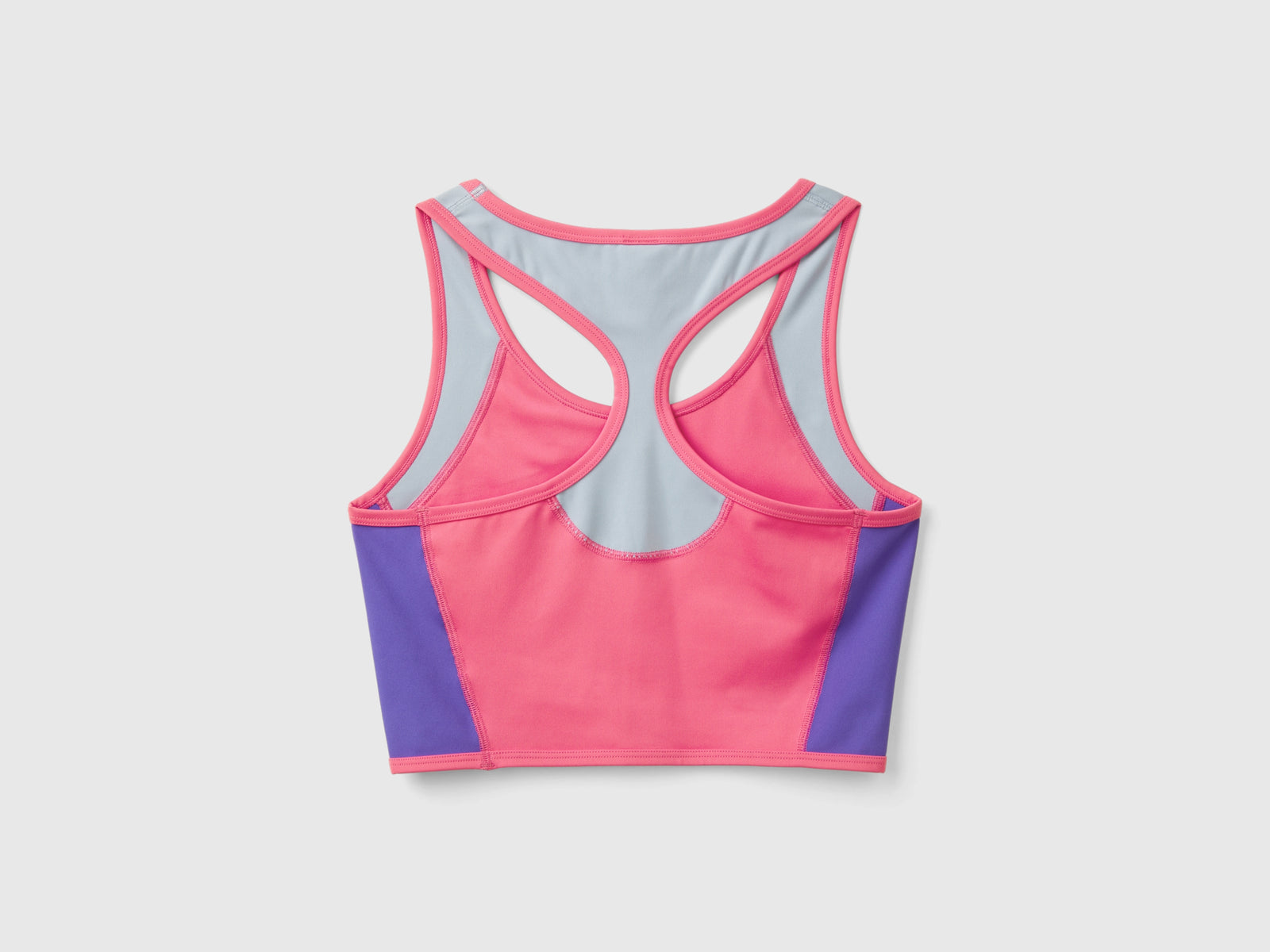 Top bra sportivo con tessuto riciclato da donna fucsia 2 | Benetton Outlet