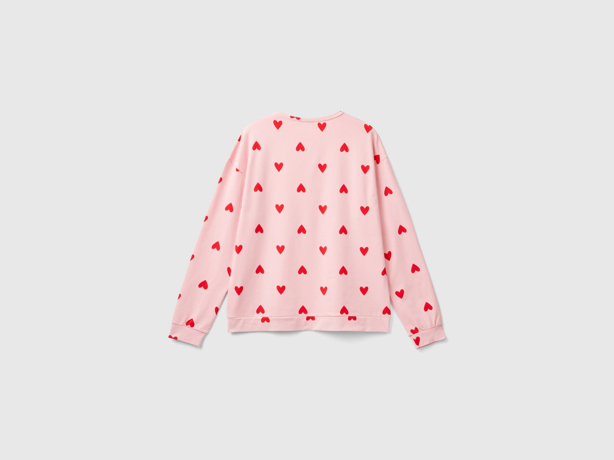 Camiseta cálida de algodón con corazones.
