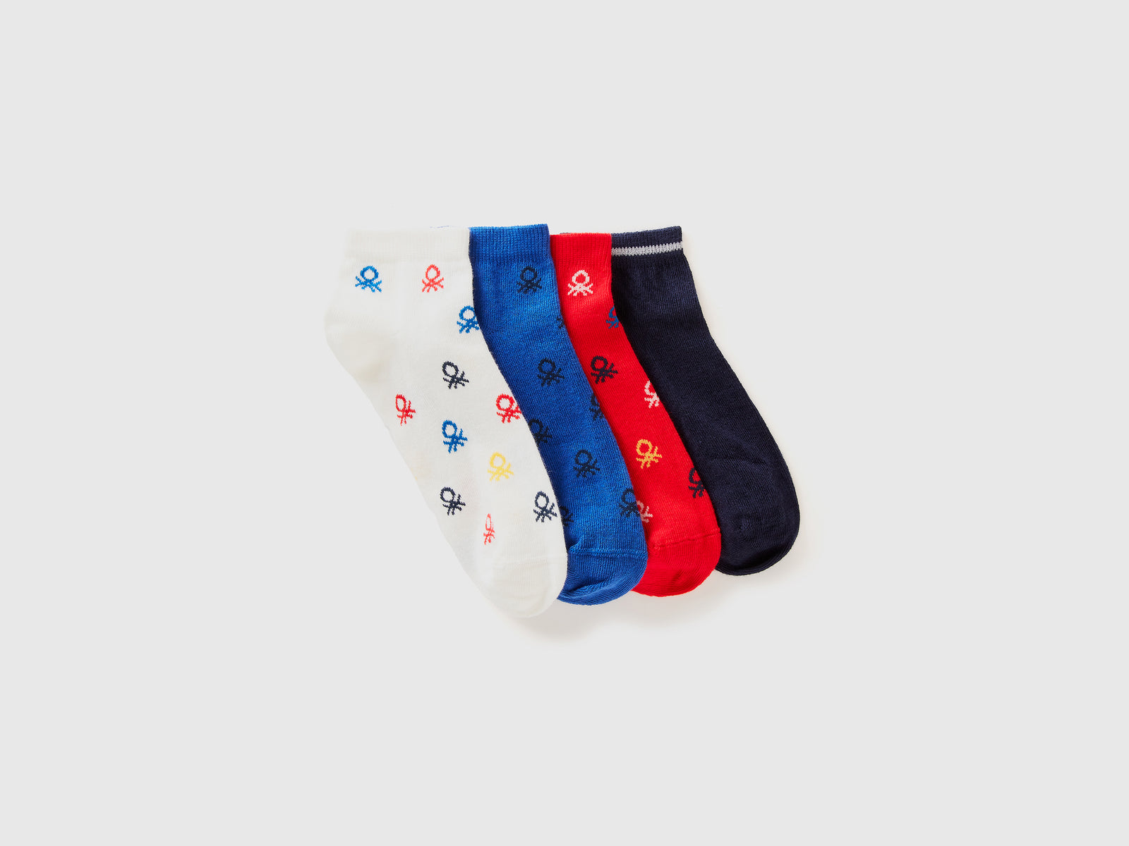 Quattro paia di calzini corti con loghi da bambino multi-color | Benetton Outlet