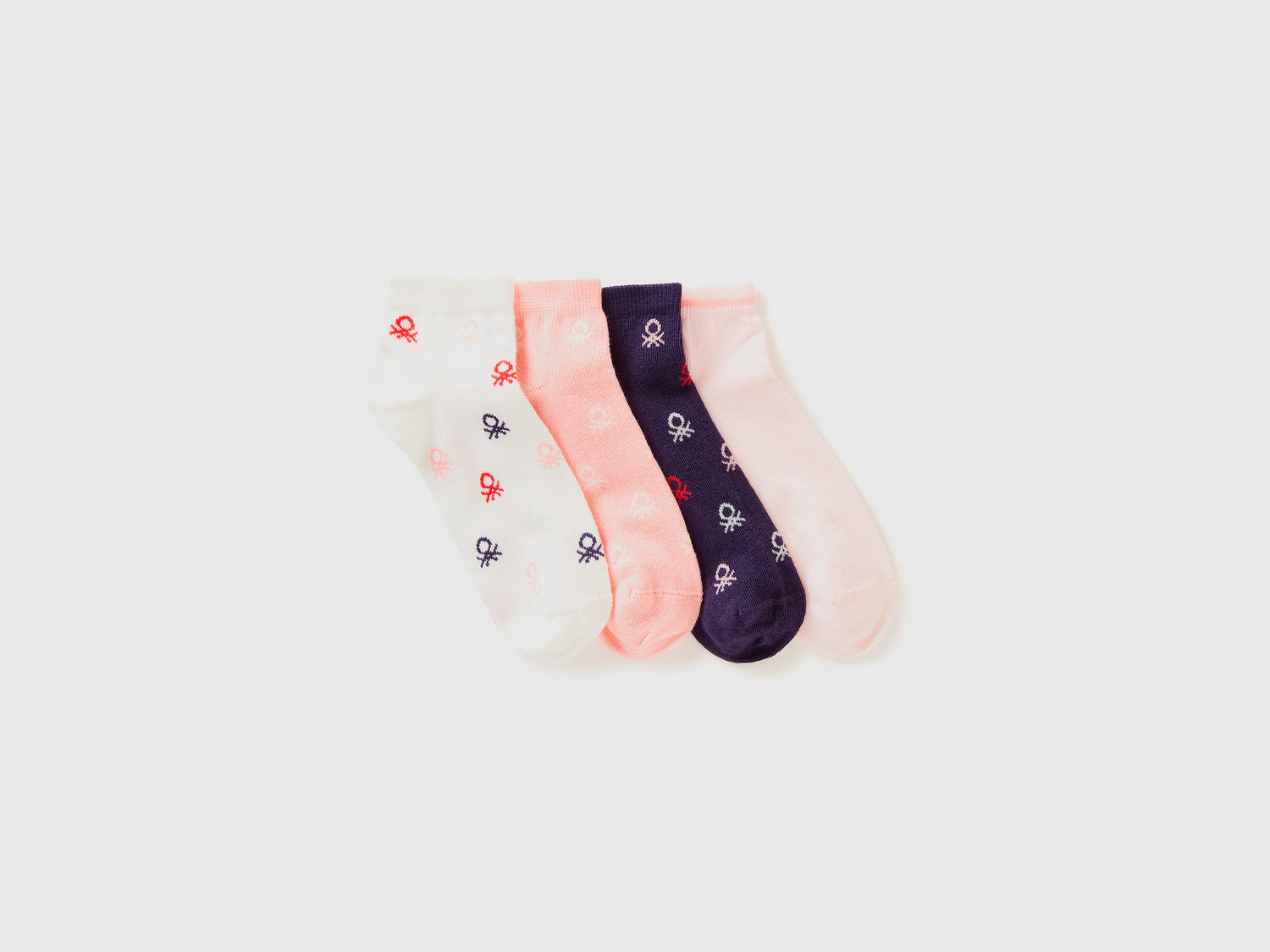 Quattro paia di calzini corti con loghi da bambino multi-color | Benetton Outlet
