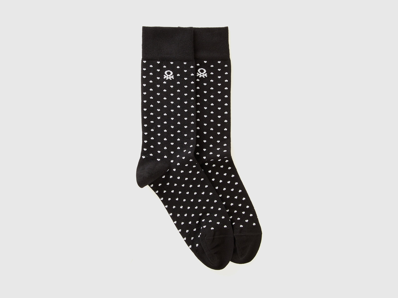 Calzini lunghi a cuori da uomo nero | Benetton Outlet